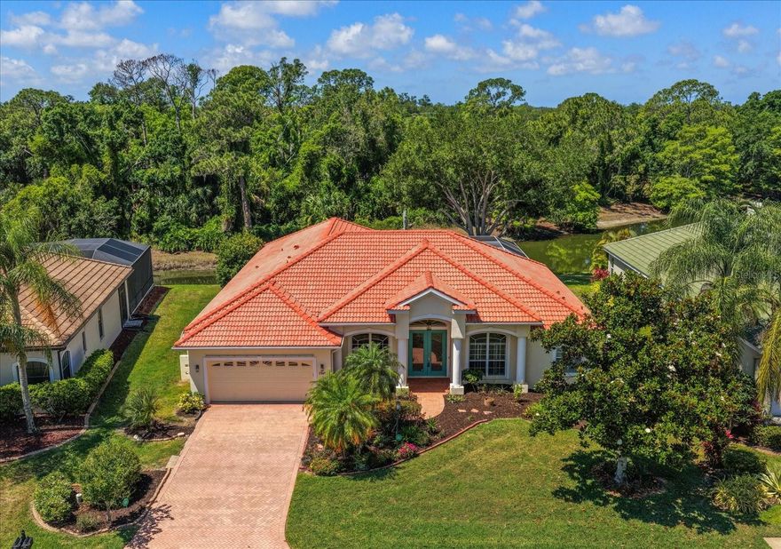One or more photo(s) has been virtually staged. Welcome to peaceful, quiet Palmer Glen, a gated, upscale community that’s just a little bit country and a little bit city.  Located just east of I-75, your new residence is a spacious, light, bright 4/3 pool home that features an open, split floor plan with plenty of room for the whole family. The soaring volume ceilings throughout add depth and drama, and the sliding doors in the family room and primary suite provide a gorgeous, tranquil water view. Sip a glass of wine on your screened and covered lanai while enjoying spectacular sunsets in the western sky. The spacious kitchen will be the center of your family’s new home and sports an extra-long breakfast bar and adjacent dinette area for communal gatherings. The Kitchen features stainless steel appliances, including double ovens. The living room, dining room and home office all feature inspiring tray ceilings that add to the upscale ambience of the entire home. Large 2 car garage, interior utility room with newer washer and dryer and HVAC 2020. The home also is fully wired for music with ceiling speakers throughout...just add your  choice of playback system. Palmer Glen has no CDD fees and a low quarterly HOA fee. Close proximity to The Celery Fields and Rothenbach Park offers many opportunities for an active lifestyle full of biking, hiking and much more. Downtown, UTC shopping and SRQ Airport are all within convenient reach, and top rated schools increase the attractiveness of this wonderful property.. Make your appointment to see it today!  All room measurements are estimates and should be verified by the buyer. There is no yard sign.