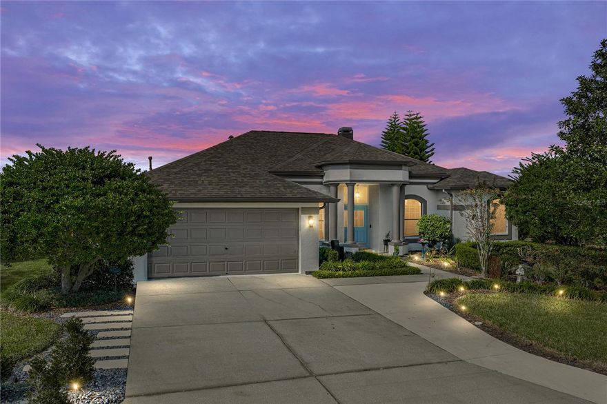 Gracefully positioned within the gates of Lake Jovita, this beautifully updated 4 bedroom + office, 2 bath pool home pairs stunning golf and water views with an inviting modern Tuscan vibe and exceptional craftsmanship throughout. Lush, manicured landscaping creates a welcoming first impression, complemented by a 2021 roof, a full outdoor kitchen, and a layout that flows effortlessly from one thoughtfully designed space to the next. The sweeping open floor plan showcases two flexible living areas, including a comfortable family room with a cozy fireplace, coffered ceiling, and triple sliding doors that frame the resort-style outdoor living space. At the heart of the home sits the completely reimagined chef’s kitchen, offering beautifully crafted wood cabinetry, quartzite countertops, a stone slab backsplash, upgraded ambient ceiling lighting, a propane cooktop, built-in oven and microwave, wine refrigerator, and a spacious island with breakfast bar seating. Every detail reflects quality, from the soft-close cabinetry and built-in drawer organizers to the pull-out toaster oven and pull-out coffee bar. An impressive walk-in pantry, finished with matching cabinetry, custom countertops, ambient lighting, and a pot hanger, elevates everyday functionality in the best possible way. Nearby, the custom laundry room adds even more convenience with a butcher block countertop designed to span the washer and dryer, custom cabinetry, a unique backsplash that cleverly conceals plumbing and electrical, and upgraded lighting for a refined finish. A dedicated executive office sits near the front of the home, offering a tranquil workspace enriched with custom wall cabinets, drawers, shelving, and a coffered ceiling. The private primary suite features upgraded wood flooring, lanai access, a spacious walk-in closet, and an ensuite bathroom with dual sinks, walk-in shower, soaking tub, and a water closet. Two guest bedrooms include custom-designed closets and stain-resistant carpet, while the luxury vinyl–finished fourth bedroom enjoys direct lanai access, providing an ideal flex space for a media room, game room, or private retreat. An entertainer’s paradise awaits outdoors where a custom-designed heated pool, upgraded finishes, and accent lighting set the stage for unforgettable gatherings. The travertine deck expands into generous covered seating areas and an impressive outdoor kitchen equipped with Alfresco propane appliances, stainless steel cabinetry, a granite bar with seating, built-in drink chest, and a handcrafted brick pizza oven made with iconic Dade City red street bricks. Every element is designed for durability, beauty, and ease of entertaining, all while taking in the exceptional pond, golf course, and sunset views that make Lake Jovita so special. Additional features include custom lighting throughout, audible-command plugs and switches, epoxy garage flooring, and carefully chosen finishes that enhance the home’s style and function. Located within the highly regarded Lake Jovita community, residents enjoy a 24-hour guarded gate, playground, basketball and pickleball courts, a dog park, and scenic walking trails. Optional membership packages to the Golf and Country Club offer access to two 18-hole golf courses, a clubhouse with restaurant and fitness center, a Jr. Olympic–size swimming pool, tennis courts, and more. Schedule your private showing today to experience every detail in person.