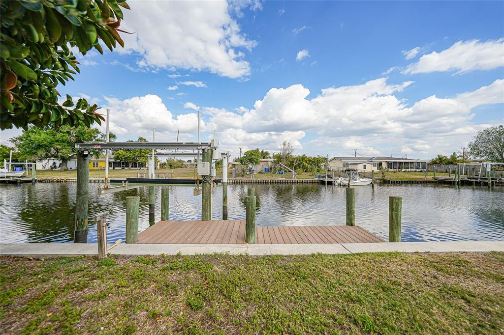 Photo of 731 Palmetto Drive NE, Port Charlotte, FL 33952 (MLS # C7522810)