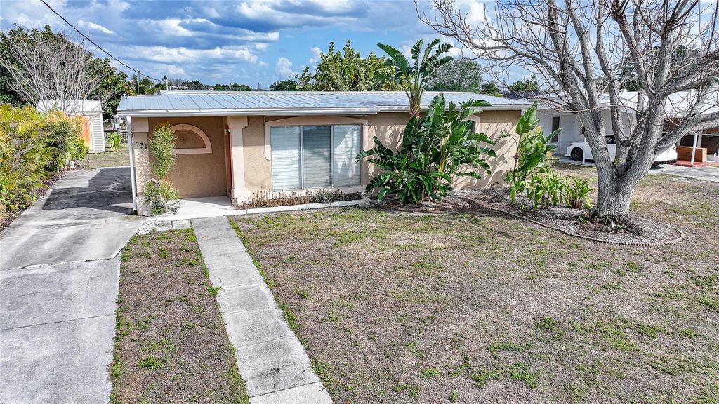 Photo of 731 Palmetto Drive NE, Port Charlotte, FL 33952 (MLS # C7522810)