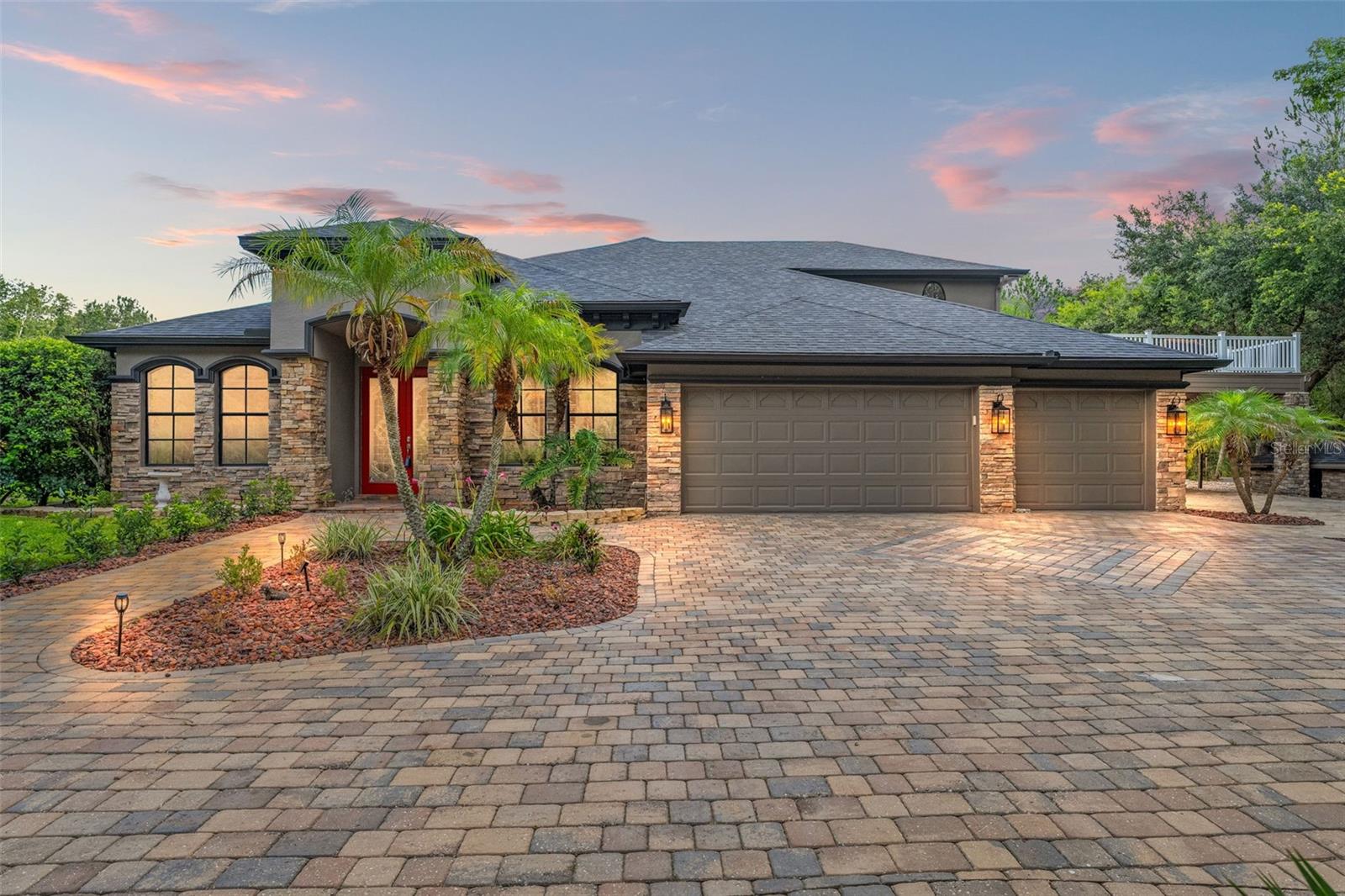 Built by a craftsman who knows how to enjoy life, this 3,300 living-sq-ft , 4100 under roof, estate is a fortress of freedom and fun. Car enthusiasts will appreciate the unmatched storage: an 11-car detached garage with oversized doors and power, a 3-car attached garage, plus a 4-car carport for boats, trucks, or toys. Out back, a resort-style setup delivers serious entertainment value—saltwater pool with a waterfall, elevated spa, sun shelf, party deck, and a tiki-style cabana for shade, drinks, and late nights. Inside, the home features 4 bedrooms and 3.5 bathrooms, including a well-appointed master suite with a private sitting area, pool access, and a resort-style bath complete with a 6-foot jacuzzi tub, glass walk-in shower, dual sinks, and a large walk-in closet. The kitchen is bold and open, with espresso wood cabinetry, level 4 granite countertops, and clear sightlines into the informal living space. Each guest bedroom has its own dedicated bathroom, offering comfort and privacy. Upstairs, a second-floor home bar was built for the pool shark, entertainer, or sports fan—just steps from the party deck, where the good times flow from room to room and all across the property. Professionally landscaped and powered by a full solar system with 2 generator backup, this estate runs with a $40/month electric bill and maximum impact. Every inch was built with purpose—for living loud, entertaining big, and storing everything you need to live wide open. Additional Noteworthy Features: • New Owens Corning shingle roof (Aug 2024) • New septic drainfield (Nov 2024) • 80-gallon hot water heater (2017) • Water softener and purification system • New pool pumps (May 2025) • Full-property irrigation system • Foam-filled block insulation • Radiant barrier in attic + R30 blown paper- backed insulation • Natural hardwood flooring throughout • 16kW solar system with battery backup • Interior and exterior paint (2024) • Tinted windows • Landscape lighting across entire property • Custom wood staircase • Composite decking • Tongue & groove ceilings on patio and party deck When the seller is also the general contractor and builder, expectations aren't just met—they're exceeded.