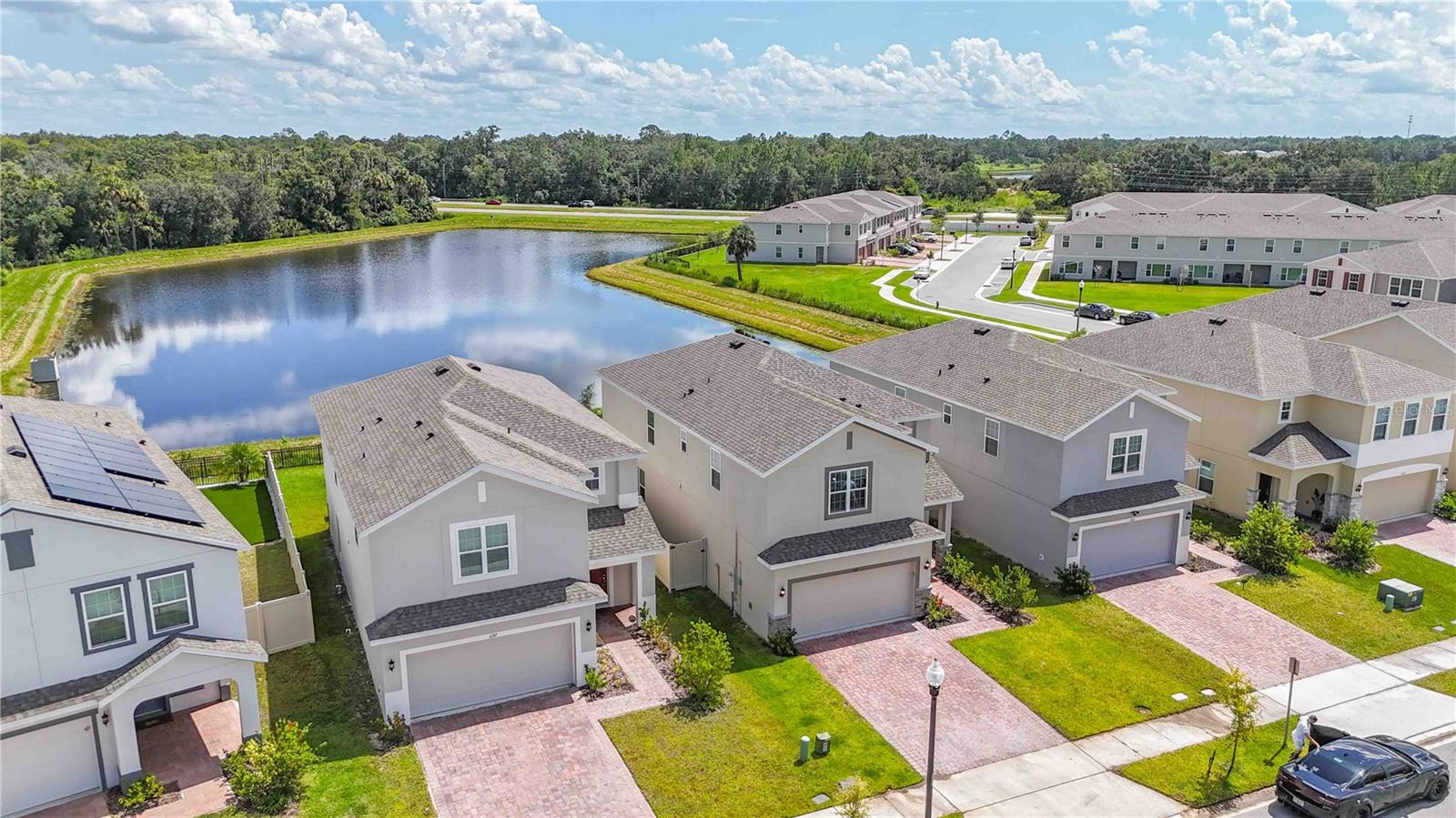This is your opportunity to live at a WATERFRONT stylish BRAND NEW 2024 home in the SOUGHT AFTER community of CYPRESS HAMMOCK. This stunning home features 4-bedroom, loft, office and 2.5-bath and it is ideally positioned on a PREMIUM WATERFRONT LOT. The owners have handpicked everything from the best, strategically located LOT to all the HIGH END finishes and UPGRADES that would made it their own dream home. This home offers over 2,400 sq. ft. of thoughtfully designed living space, high ceilings, blending modern comfort with timeless style.
The heart of the home is the CHEF-INSPIRED kitchen, showcasing QUARTZ countertops, STAINLESS STEEL appliances, and an OVERSIZED ISLAND that seamlessly connects to the open-concept living and dining areas. Spacious dinning that fits a large table and an office adorned with charming FRENCH DOORS are part of the first floor open social area where everyone can be together, even if doing different activities at home. A custom built TV wall with wooden niches holds a nice decorative FIREPLACE. SOUND SYSTEM makes the living room the perfect place for watching movies or listening to good music.
Expansive sliding doors frame serene WATER VIEWS creating a light-filled atmosphere perfect for both relaxation and entertaining. Outside, a COVERED LANAI and FULLY FENCED backyard with NO NEIGHBORS in the back, make this home a very private place to enjoy being outside with family and friends.
Upstairs, a SPLIT FLOOR-PLAN has the primary suite on one side, a very spacious and COMFORTABLE LOFT in the middle and three bedrooms on the other side. The primary suite is a PRIVATE RETREAT, complete with a generous WALK-IN CLOSET. A spacious LAUNDRY ROOM upstairs facilitates the every day routine. Additional features include a 2-car garage, tile and laminate flooring in main areas, and ample storage throughout.
Beyond the home itself, the location elevates everyday living: enjoy guest parking directly across the street, the glow of charming streetlights at your doorstep, the community clubhouse just steps away for RESORT STYLE AMENITIES and a great K-8 school just 5 min drive away.
Don't miss this opportunity! Make their dream home your home!