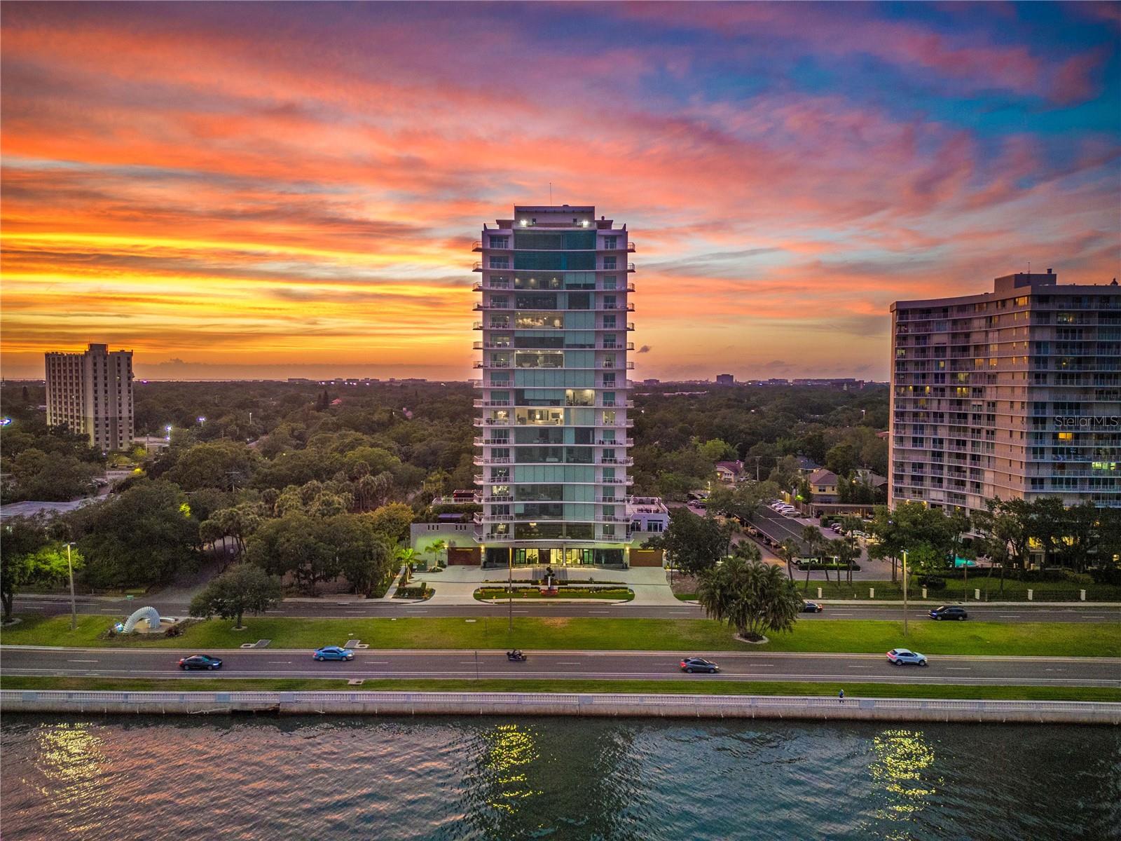 Welcome to an unparalleled waterfront residence. The Sanctuary is a bespoke full-floor home that redefines elevated high-rise living with concierge service. This exceptional residence offers stunning 360-degree water views of the iconic Bayshore, a rare jewel in one of South Tampa’s distinctive addresses. With private elevator access, two balconies and two exclusive terraces, it delivers unmatched privacy and sophistication along Bayshore Boulevard. Spanning 5,264 square feet, Residence 200 has been expertly curated to reflect refined elegance. Walls of glass invite abundant natural light, framing panoramic water views that evolve throughout the day and create a warm, uplifting ambiance. At the heart of the home, the chef’s kitchen is visually striking and highly functional, designed for culinary creativity and entertaining. It features Gaggenau appliances, two top-of-the-line refrigerators, exclusive access to two private terraces and a whole-unit generator for peace of mind. The luxurious primary suite showcases serene water views, a spa-inspired bath and a custom walk-in closet. Three additional bedrooms with en suites provide comfort, privacy and flexibility for guests, work or wellness needs. Each floor is dedicated to a single residence, so The Sanctuary lives up to its name, offering an extraordinary level of exclusivity and ease with just 15 elite homes in one of Bayshore Boulevard’s desired locations. Residence 200 also features one of the largest private outdoor living spaces in the building. Residents enjoy access to a collection of curated amenities, including a heated outdoor pool, private cabanas, a state-of-the-art fitness studio and a tranquil spa. Here, luxury is not only defined by impeccable finishes but by the effortless, personalized lifestyle it affords. This is an elevated way of living, entirely your own in the heart of Florida.
