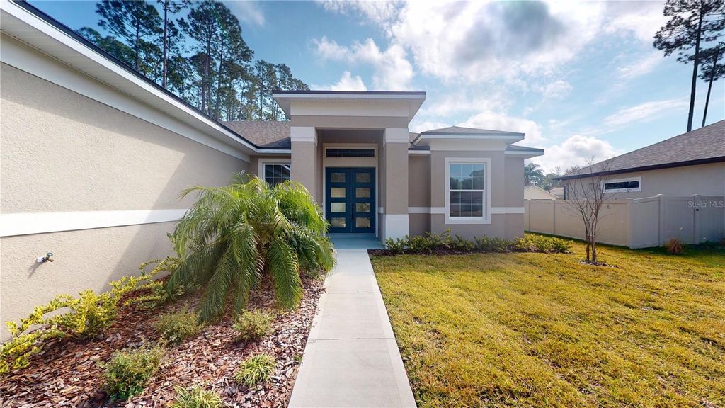 Photo of 9 Evanston Lane, Palm Coast, FL 32164 (MLS # FC313185)
