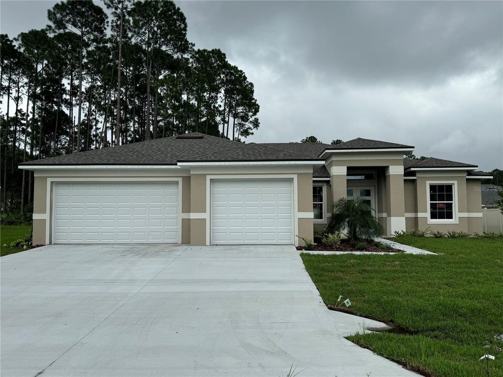 Photo of 9 Evanston Lane, Palm Coast, FL 32164 (MLS # FC313185)