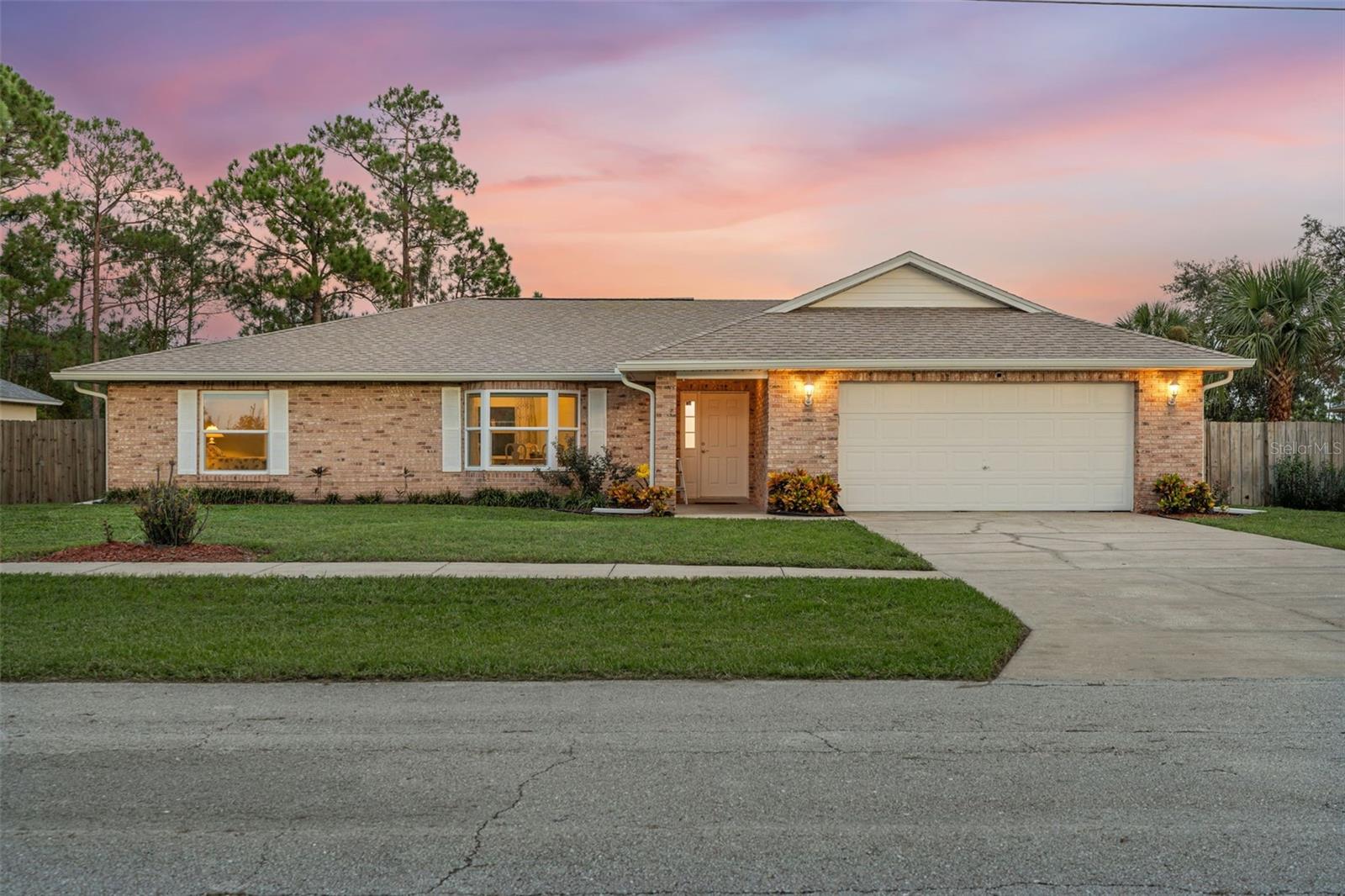 Lakefront Living in Deltona! This 4-bedroom, 2-bath home sits on a spacious .34-acre cul-de-sac lot with beautiful curb appeal and a screened saltwater pool overlooking Lake Theresa: enjoy both water views and backyard access. Inside, the split-bedroom floor plan offers privacy, while the open kitchen, living, and dining areas make everyday living and entertaining easy. Two versatile flex spaces give you room for an office, playroom, or hobby area. The primary suite features a walk-in closet and a spa-like bath with dual sinks, soaking tub, and separate shower. With a 2-car garage and an ideal location between Orlando and New Smyrna Beach, this home truly has it all. Pool, lake, and space for everyone, schedule your showing today and see why this home is the perfect fit!
