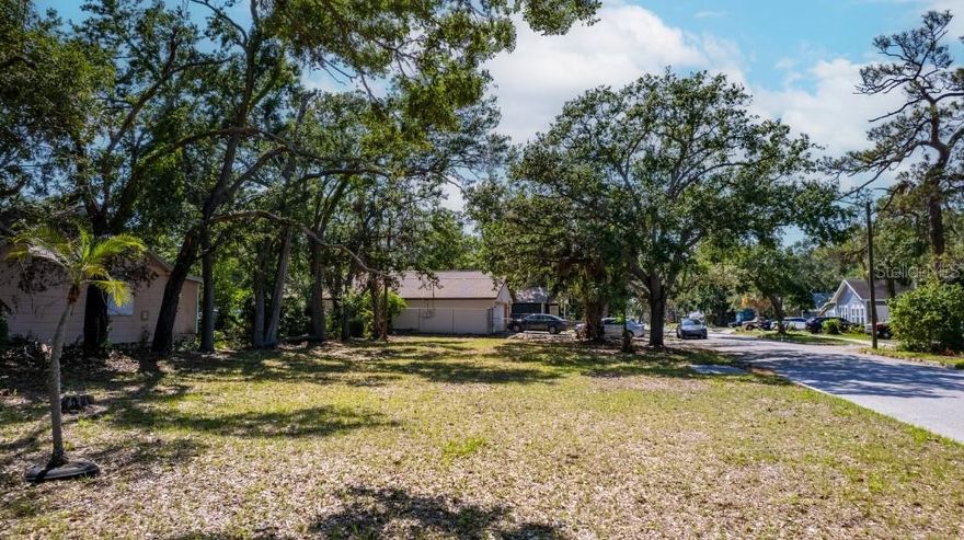 Location, Location and Equity! ! Talk about an opportunity. This spacious corner lot is nestled in the fast-growing Oak Harbor neighborhood that's less than three miles from Downtown St Petersburg and Tropicana Field.  The lot offers ally access and is zoned so you can build a house with an income generating garage apartment or additional dwelling unit (ADU). This Is your chance to own property in a rapidly developing neighborhood that's ripe with new construction and development. The lot sits at higher elevation than most properties in the area and utilities are on site which reduces city impact fees for building. You can easily build your dream home and end up with hundreds of thousands of sweet equity. Why buy an older house at the top of the market when you can build a new home and gain instant equity.