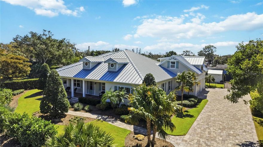 Tucked away in highly desirable Northwest Bradenton, just minutes from the stunning Gulf beaches, this exceptional 4-bedroom, 3-bath residence is a rare opportunity to own a meticulously maintained home that truly checks every box. From the moment you arrive, the amazing landscaping and lush, professionally curated grounds set the tone for what awaits inside — pristine care, thoughtful upgrades, and undeniable quality throughout. The backyard is a private retreat featuring a tranquil waterfall feature surrounded by mature tropical landscaping, creating a peaceful setting for relaxation or entertaining. With a well-fed irrigation system, your grounds stay green and vibrant year-round. Inside, the home offers spacious, oversized bedrooms with abundant closet space and a thoughtfully designed layout that includes a private guest suite complete with its own full bath and separate living room — perfect for multigenerational living or long-term guests. Ceramic tile flows through the main living areas, while the garage features polished concrete flooring for a clean, finished look.
The kitchen is designed for both beauty and performance, showcasing solid wood soft-close cabinetry, stainless steel appliances, gas cooking, an impressive range hood, and reverse osmosis water at the sink. A Kinetico water softener and whole-home filtration system ensure premium water quality throughout. Built for efficiency and comfort, this home features a durable metal roof, foam insulation, a zoned 5-ton main A/C system plus a dedicated 1-ton unit in the primary suite, and a tankless water heater. Security cameras provide peace of mind, and the oversized garage doors, extra-long driveway, and spacious garage offer ample room for vehicles and storage. This is not just a home — it’s a meticulously upgraded property that must be seen to fully appreciate the craftsmanship, functionality, and incredible value offered in one of Bradenton’s most sought-after locations near the beaches. Schedule your private showing today and experience it for yourself.