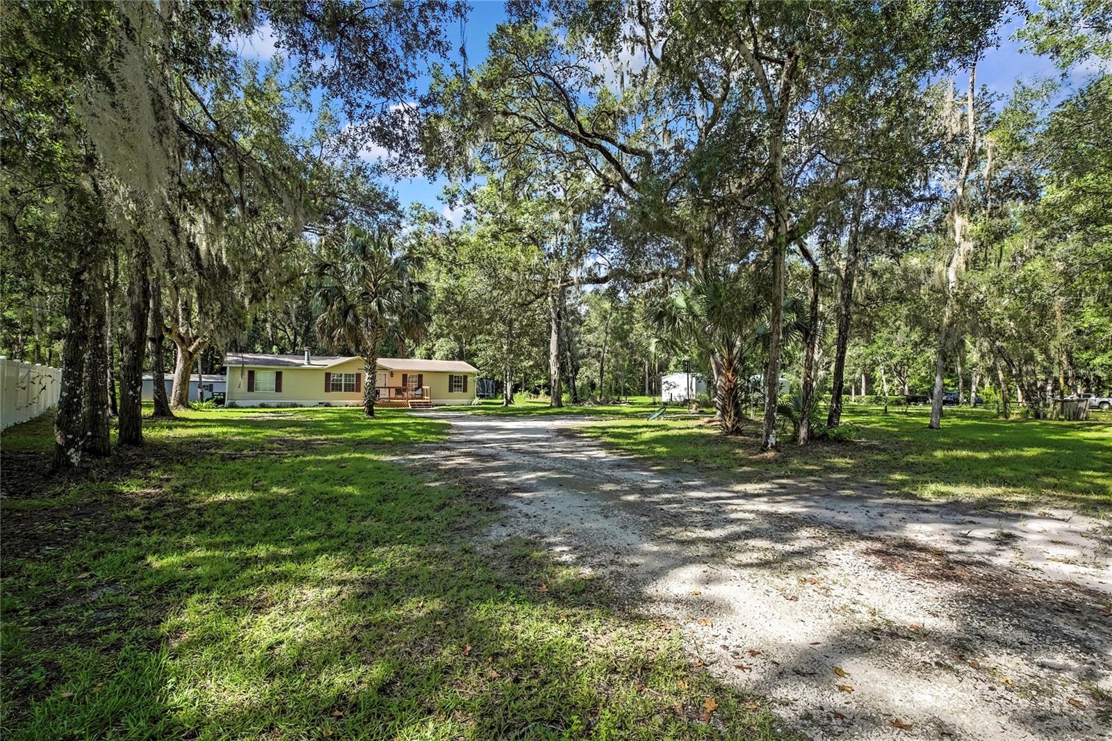 Welcome to this adorable move in ready 3-bedroom, 2-bathroom home located in the highly sought-after Royal Highlands community. Situated on a spacious 0.99-acre lot, this property is zoned Residential Agricultural (AR-2), offering flexibility for gardening, recreational toys, or even horses, within allowable limits.
Enjoy peace of mind with a newer roof (2020) and a brand-new A/C unit (2024). Inside, the home features remodeled bathrooms, retextured walls, and crown molding throughout, giving it a fresh, modern feel. The open floor plan offers a large living room and dining area, perfect for entertaining or everyday living.
A bonus room provides versatile space and could easily be enclosed to create a private office or 4th bedroom. The split-bedroom layout adds privacy, making it ideal for families or guests.
Set back from the road, the property offers a tranquil, rural atmosphere while still being conveniently close to everything. Walk to the nearby nature preserve, hop on the bike trail just down the road, or enjoy the Weeki Wachee River and local boat ramps only minutes away.
Don't miss this unique opportunity, schedule your showing today!
*Buyer to verify all information for accuracy.*