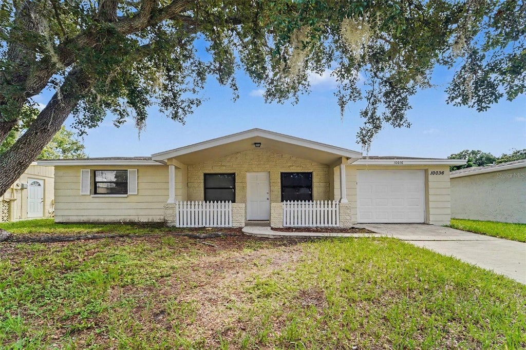 Photo of 10036 Glen Moor Lane, Port Richey, FL 34668 (MLS # O6440317)
