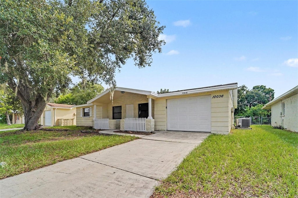 Photo of 10036 Glen Moor Lane, Port Richey, FL 34668 (MLS # O6440317)