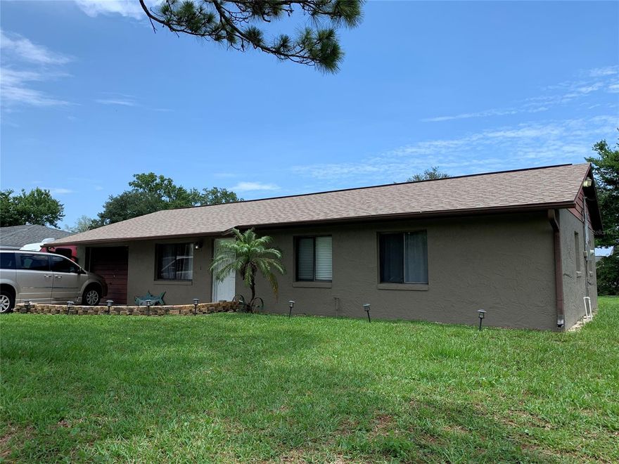 Concrete block 2/2 located in a quiet neighborhood has been modified by its' current owner to be handicap accessible as well as new kitchen, all new flooring, newer roof 2018 & HVAC 2012. Garage has been converted to living/storage space, but could be changed back to a garage. ;Water: City