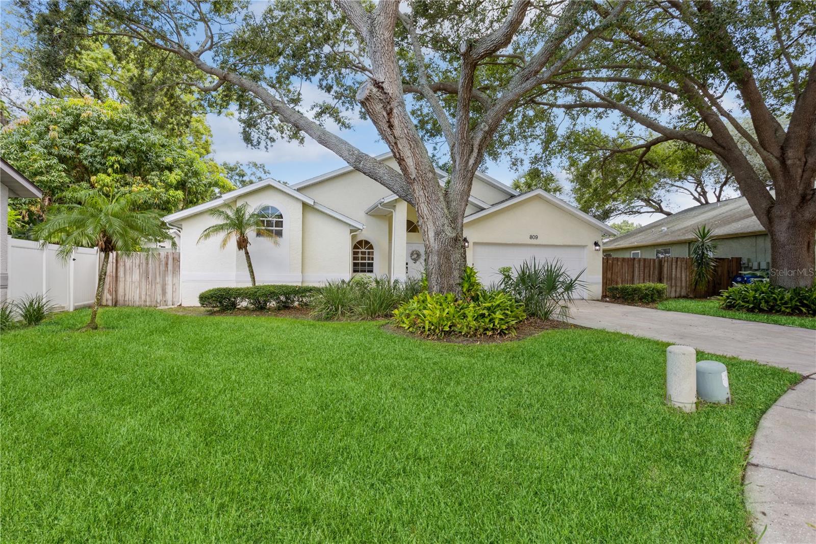 Under contract-accepting backup offers. Welcome to your new spacious move-in ready home with 3 bedrooms, 2 baths and a lovely pool nestled in a very private backyard. Crystal Beach Estates is a hidden gem in Palm Harbor and this property located in a quiet cul-de-sac offers everything you are looking for. As you enter through the front door, you will notice the large open space with a combination of living room and dining room leading towards the large kitchen. This open floor plan in the Gourmet kitchen with a large central island is perfect to gather your family and friends with a breakfast area overlooking the backyard and a cozy family room. The Kitchen boasts stainless appliances, wood cabinets, and a built-in pantry. You will appreciate the soaring cathedral ceiling, the wood flooring throughout the entire home, the wet bar in the dining room.... The abundance of natural light in this property procures a sensation of calm and serenity. The split floor plan has the master suite and guest bedrooms in two different wings, great for privacy. The oversized covered lanai gives you great opportunities to host parties or to simply relax enjoying your pool and spa oasis and your lush backyard. New AC, propane tank for your grill, new pool heater, and well sprinklers system. No HOA, no flood insurance! Minutes away from schools, shopping and the beautiful beaches of Honey Moon Island, Clearwater Beach, and Pinellas trail ....schedule your appointment today!