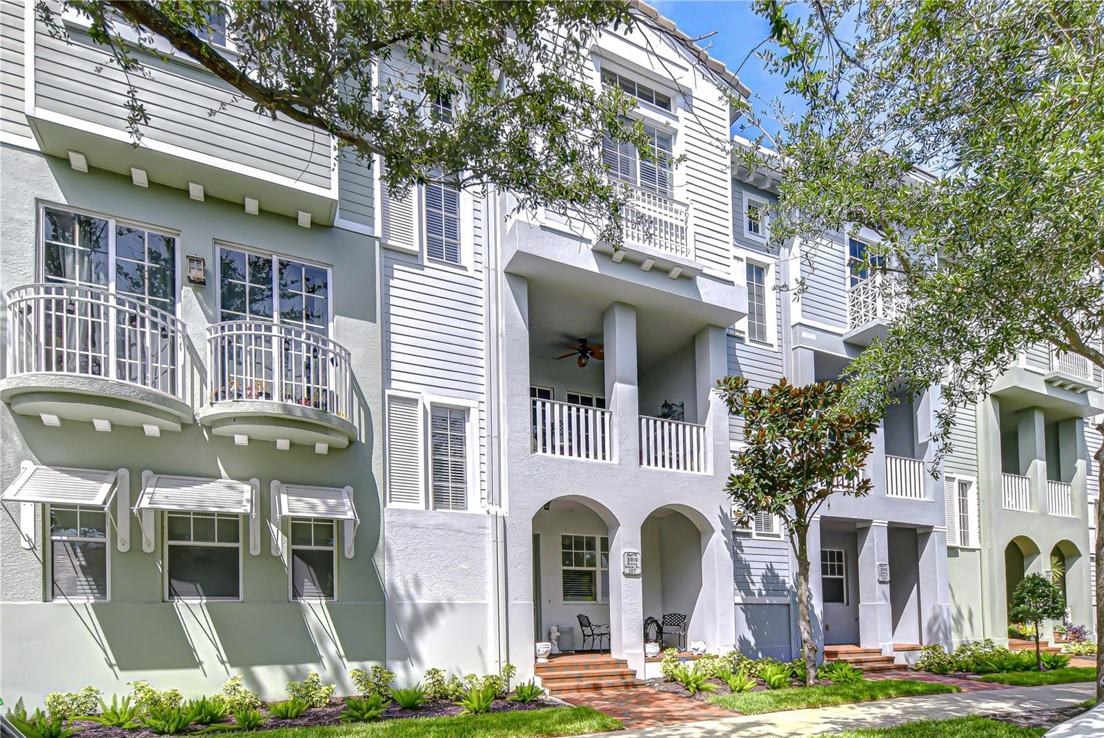 Welcome to Westshore Yacht Club – South Tampa’s premier gated waterfront community. This beautifully maintained luxury townhome features the highly sought-after Davis floor plan, offering nearly 1,900 square feet across three stories with 3 bedrooms, 2 full baths, 2 half baths, a private den/flex space, and an upgraded elevator replaced in 2024 for effortless living. From the inviting front porch with brick pavers to the gracious entry foyer, every detail has been thoughtfully designed. The first-floor den with a walk-in closet provides the perfect space for a home office, playroom, or even a guest retreat. The attached two-car garage offers plenty of storage. On the main living level, you’ll find soaring 10-foot ceilings, crown molding, rich engineered hardwood floors, and abundant natural light. Elegant plantation shutters were installed throughout the entire home in 2025, adding timeless beauty and privacy. The open-concept design seamlessly connects the spacious living and dining rooms to the windowed kitchen, complete with stainless steel appliances, granite countertops, wood cabinetry, a breakfast bar, and a pantry closet. A large covered balcony extends your entertaining space, perfect for grilling or unwinding. Upstairs, the serene primary suite features 12-foot tray ceilings, a custom walk-in closet, and a spa-inspired bath with dual vanities and a walk-in shower. Two generously sized secondary bedrooms with custom closets share a well-appointed hall bath, while the laundry area with full-size washer and dryer is conveniently nearby. Plush new carpet was also installed throughout the upper level in 2025. Recent upgrades include water heater replacement in 2023, and the upgraded elevator in 2024—ensuring peace of mind for years to come. Resort-style living awaits. Westshore Yacht Club offers unmatched amenities, including a private 149-slip marina, members-only Bay Club, two resort-style pools, Tiki Bar, Compass Day Spa, 806 Sunset Bar, state-of-the-art fitness center, billiards room, community and dog parks, and a full calendar of resident events. Enjoy the best of waterfront luxury living with convenient access to downtown Tampa, St. Petersburg, MacDill Air Force Base, Tampa International Airport, and Gulf Coast beaches. This is more than a home—it’s a lifestyle. Don’t miss your opportunity to own in one of South Tampa’s most exclusive communities. Copy and paste this link to tour the home virtually: my.matterport.com/show/?m=gaMYxCxUa2A&mls=1