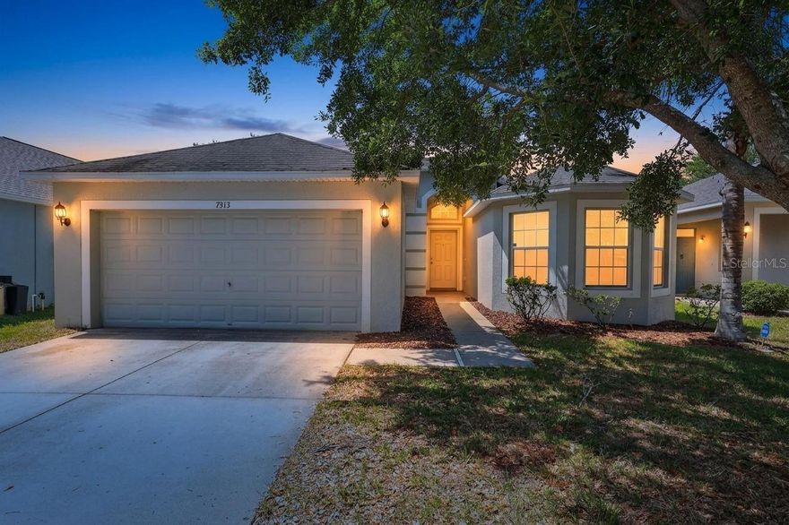 One or more photo(s) has been virtually staged. Welcome to the charming Cypress Creek development offering a community pool, basketball courts, playground and more.  Conveniently located to ensure easy access to Downtown Tampa, you'll enjoy West Coast living in this tidy neighborhood. A well appointed floor plan gives you relaxing views of the pond from several rooms in this 4 bedroom 2 bathroom home.  The 3 stall garage has plenty of room for your tools and toys.  Inside you'll find tile and wood flooring, vaulted ceilings and an inviting living area full of sunshine. An open kitchen with stainless appliances, tile backsplash and ample cabinet & counter space will quickly make this your favorite space.  Vaulted ceilings look out over an attached dining area making it the perfect gathering spot.  A large master bedroom with dual walk-in closets and private spa like bath including two vanity areas and a garden tub with separate shower make this the owners suite of your dreams. Sliding glass doors from the living area lead to a covered patio where you can relax and enjoy the view of the picturesque backyard perfect for yard games, family gatherings, BBQ's and more.  Welcome Home!
