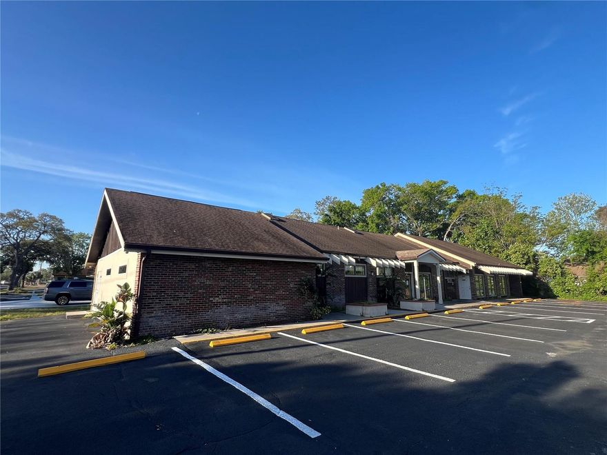 This 2,920 SF New Port Richey professional office building is located on a shared (2 unit) site. The space was formerly used as a medical lab but would work nicely as a medical office as it is located in a market surrounded by dense residential and complementary medical uses. As you walk through the front door, you enter into a large reception and waiting area with a waiting room large enough to accommodate 12-14 guests. The adjacent reception office is set up for two stations with an open bullpen area behind it. At the rear of the space, there are 4 private offices / exam rooms, 2 restrooms, a large open area, and another wide open bullpen area. The space is in need of some cosmetic improvement and is ready for a new occupant to put their imagination to use with this flexible open floor plan.

Located in New Port Richey just east of US-19 with easy access to the Suncoast Parkway and Veterans Express.