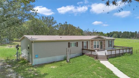 Photo of 7565 Dewey Robbins Road, Howey In The Hills, FL 34737 (MLS # OM702781)