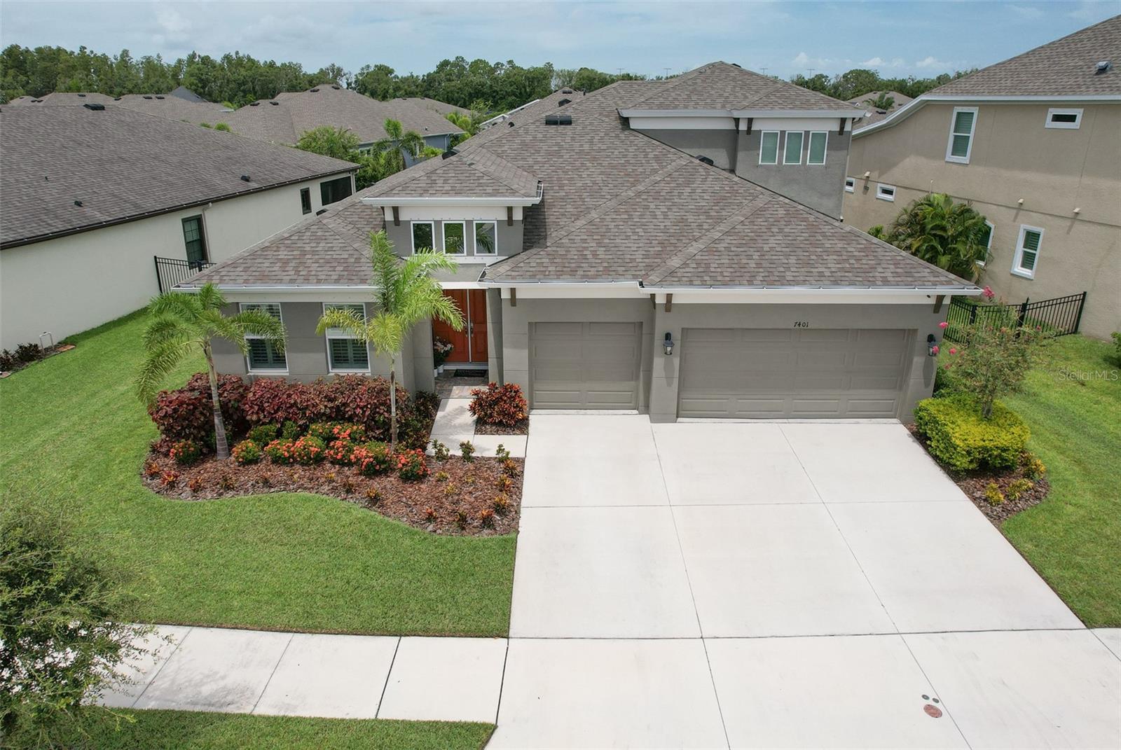 Back on the Market with upgrades!!! Welcome to luxury living in the heart of Waterset! This stunning 5BR/4BA Bayshore II by WestBay offers 3,199 sq ft of meticulously designed living space on a beautifully landscaped lot with a spacious 3-car garage. Step into elegance with soaring ceilings, an open-concept layout, and stylish finishes throughout. The gourmet kitchen is a chef’s dream featuring a gas cooktop, stainless steel vent hood, built-in oven, wine refrigerator, oversized island, and walk-in pantry—ideal for entertaining. Retreat to the king-sized first floor primary suite, complete with two walk-in closets, en suite bath with dual vanities, and a luxurious walk-in shower. All bedrooms feature luxury vinyl plank flooring, combining durability with a refined look. Upstairs, enjoy movie nights in the dedicated media room, complete with a projector and screen (furnishings negotiable). Enjoy Florida’s indoor-outdoor lifestyle year-round on the covered and screened lanai, upgraded with elegant tile flooring and ceiling fan. Community features include resort-style pools, fitness center, tennis, pickleball, playgrounds, walking trails, and more. Additional highlights: hurricane shutters, tankless water heater, pest control system, smart home infrastructure, and energy-efficient design. Zoned X – no flood insurance required. Low HOA & CDD. Don’t miss this exceptional home!