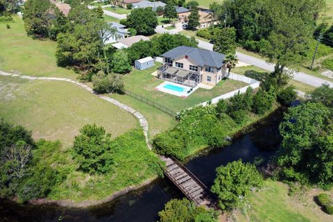 Photo of 208 London Drive, Palm Coast, FL 32137 (MLS # FC318560)