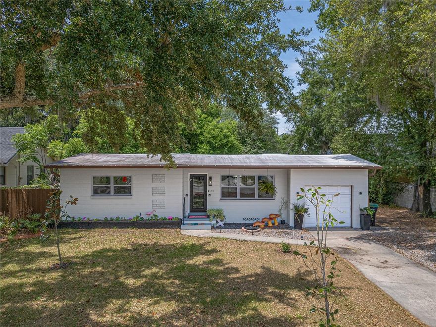 You're going to fall in love with this beautifully updated mid-century home in the highly sough-after SODO District. From the moment you arrive, the eye-catching curb appeal sets the tone for what awaits inside. Situated on both Lot 76 and Lot 77, this rare property offers a combined .26 acres - an uncommon find in this area. The renovated kitchen features soft-close cabinetry, marble countertops, a Bosch dishwasher, induction oven, and a new refrigerator, making it as functional as it is stylish. Just off the kitchen, you'll find the 1-car garage with a newer garage door (2022), as well as a currently used as a dedicated laundry room complete with built-in shelving for added convenience. One of the home's standout features is the versatile Florida Room. Currently used as a charming sitting area but easily adaptable to fit your lifestyle needs - whether as a home office, playroom, or additional entertaining space. The expansive backyard offers endless possibilities, with plenty of room to add a pool, create a garden oasis, or design your dream outdoor retreat. Enjoy evenings on the brick paver patio gathered around a firepit, while the oversized storage shed (10X12) provides ample space for tools, lawn equipment, firewood, or just used as extra storage. Major update include: Roof (2017), A/C (2020), Windows (2020), Water Heater (2026), New Attic Insulation (2024), New Electrical Panel (2024), along with updated wiring and plumbing for added peace of mind. Living in the SODO District, also means access to highly regards schools, such as Blanker K-8 and Boone High School. Conveniently located with easy access to I-4, the East-West Expressway, Orlando International Airport, and countless shopping and dining destinations. This home combines comfort, charm and location.