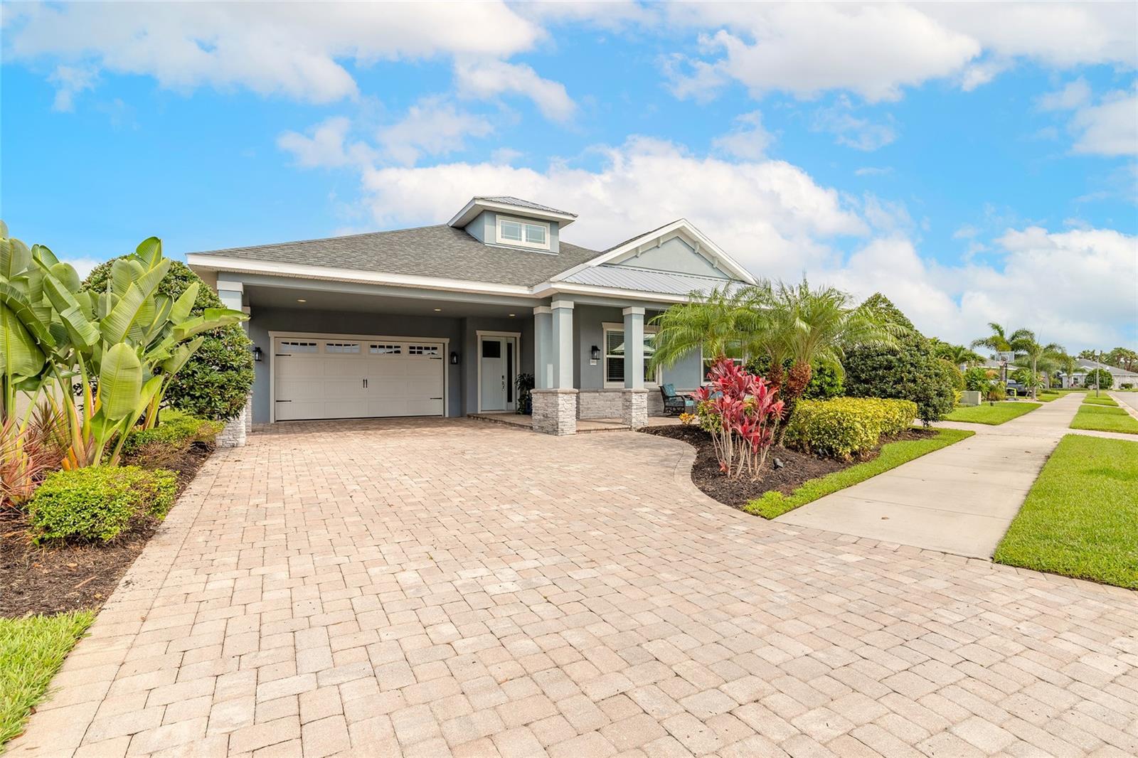 Welcome to 2931 Bella Flore, a meticulously maintained, move-in ready home nestled in a gated golf course community. This stunning 4-bedroom, 3-bath residence features a spacious open layout with porcelain tile throughout the main living areas, soaring 16-foot ceilings in the foyer, and 12-foot ceilings in the primary living spaces. The large flex room offers versatility as an office or den. The chef’s kitchen boasts white cabinetry, a large walk-in pantry, and overlooks the expansive living area. The primary suite is a luxurious retreat with a tray ceiling, double sinks, a walk-in shower with dual shower heads and bench, and a massive walk-in closet. Enjoy Florida living at its finest with a screened pool featuring a sun shelf and water feature, a spacious pavered lanai, and a freestanding spa, all within a large, fenced backyard. The oversized 2-car garage is paired with a porte cochere allowing covered parking for up to 4 vehicles. Additional features include 8-foot doors, a spacious laundry room with sink and sun tunnel, and lush, manicured landscaping. This home combines elegance, function, and comfort in one exceptional package. All information is intended to be accurate, however not guaranteed.