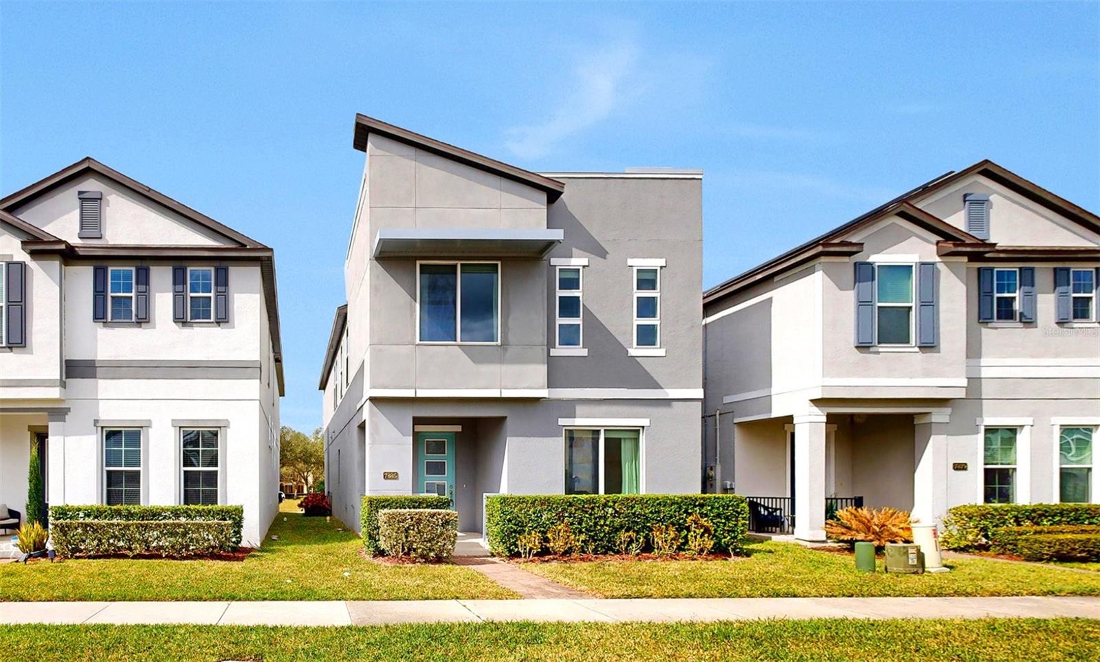 Welcome home to this immaculate 4 bedroom, 2 1/2 bathroom home in coveted Windermere, FL. Right when you walk through the doors you will be blown away by how beautiful the home is. The first floor has dark, wood-like tile throughout that looks absolutely stunning. It's a perfect open floor plan that features a living room, dining room, and an amazing kitchen. The kitchen has quartz countertops, upgraded Kitchen-Aid appliances, and custom backsplash. Other first floor features include a bar area, a half bath, and a drop zone off the garage. Also, the current owners replaced all of the builder mirrors with custom mirrors throughout the home. The second level has a nice sized loft, 3 bedrooms, a full bathroom, and of course, the Owner's Suite. The Owner's Suite has a tons of natural light, and a fully upgraded bathroom with dual vanities, an exquisite shower, and a big closet.