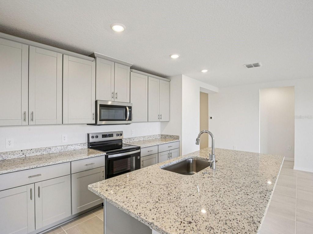 Photo of 823 Sunshower Drive, Lady Lake, FL 32159 (MLS # TB8510554)