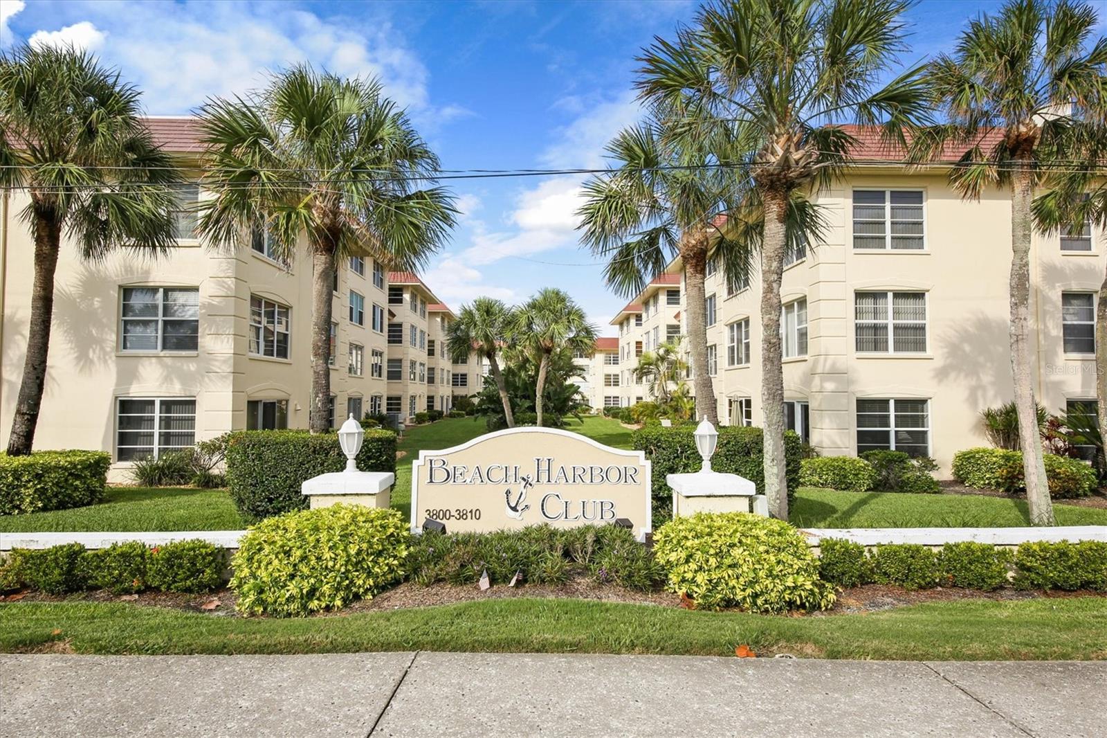 Lovely, spacious 2/2 second floor corner unit in a Gulf-to-Bay community on Longboat Key. Enjoy gorgeous views of the community’s private beach and the Gulf of Mexico from both the master bedroom and the living room windows. Unit features an open concept living and dining area with tile floors throughout, a new air conditioning system in 2023, and 2 new impact windows in the bathrooms. This unit conveys with a coveted assigned covered parking spot and one additional guest spot. Updated kitchen with solid wood cabinets, granite countertops and stainless-steel appliances. Turnkey investment property successfully rented as a vacation rental during the high season and is currently occupied by excellent annual renters through mid-July 2025. The community includes a nicely appointed clubhouse with fitness room and library, laundry facilities, designated beach lockers to keep sand out of your unit, indoor bicycle storage, kayak launches, cabana grilling areas, a saltwater pool, woodworking room, carwash bay, and boat docks (under repair and scheduled for completion in 2025).