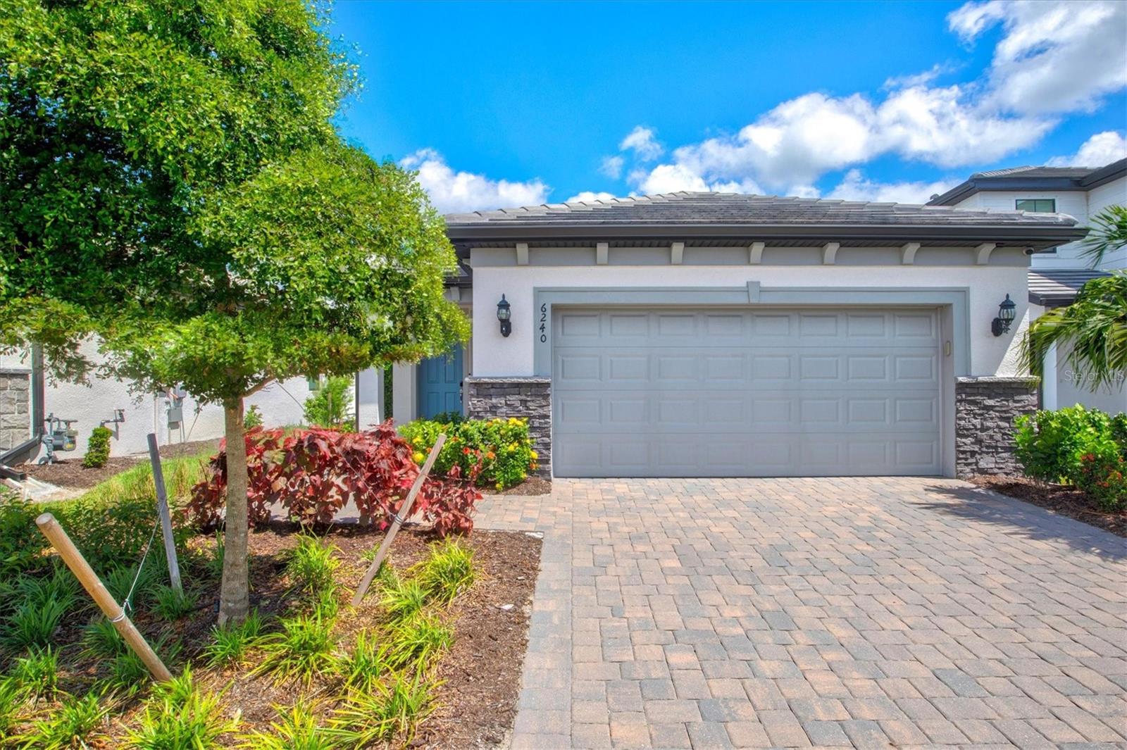Welcome to resort-style living in the sought-after gated community of Talon Preserve on Palmer Ranch. Built in 2022, this 3-bedroom, 2-bathroom home is the definition of move-in ready, showcasing model-like finishes and thoughtful upgrades throughout. From the moment you arrive, lush, meticulously maintained landscaping—courtesy of the HOA—frames the pavered driveway, setting the tone for the elegance within.
Step inside to an open-concept great room that effortlessly flows into the chef-inspired kitchen, where quartz countertops provide generous barstool seating, stainless steel appliances (including a gas range), and a modern tile backsplash create both style and function. High ceilings and crown molding throughout elevate the space, while large windows bathe it in natural light.
The owner’s suite offers a peaceful retreat with a peekaboo water view, a spacious walk-in closet, and a spa-like ensuite bathroom featuring dual sinks and a frameless glass walk-in shower with floor-to-ceiling tilework. Two additional bedrooms are comfortably sized and share access to a beautifully appointed full guest bath.
Enjoy Florida’s indoor-outdoor lifestyle on the screened-in pavered lanai, where privacy meets pond views for the perfect morning coffee spot or evening wind-down. Located outside the flood zone with low HOA fees, no CDD, and zoning for A-rated schools, this home delivers both value and peace of mind.
Life at Talon Preserve is more than just a home—it’s a destination. Residents enjoy a resort-style heated pool with rock waterfall and splash pad, spa, full-service restaurant and bar, 18,000 sq. ft. clubhouse, state-of-the-art gym, arcade, 8 pickleball courts, tennis and bocce courts, and a dog park. With direct access to the Legacy Trail and close proximity to Oscar Scherer State Park, pristine Gulf beaches, Sarasota Memorial Hospital, championship golf courses, and the vibrant downtowns of Sarasota and Venice, everything you love about Florida living is within easy reach.
Schedule your private showing today!