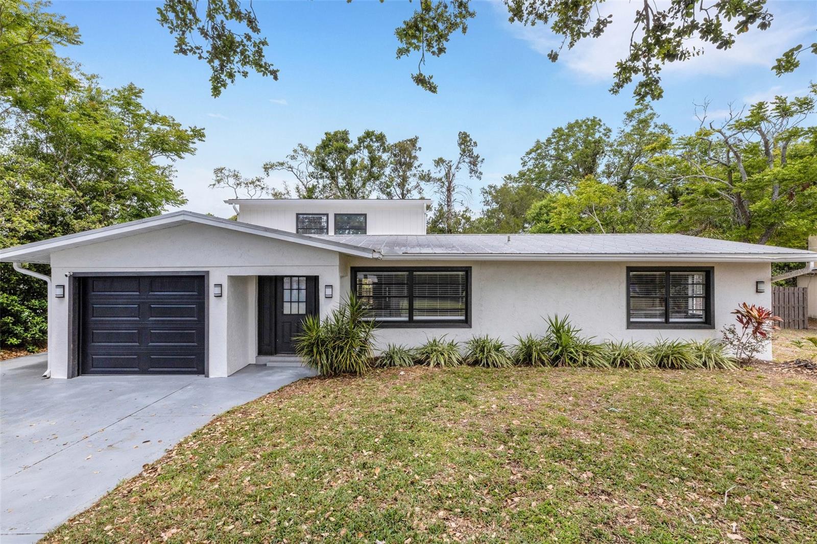 Discover the perfect blend of comfort and sophistication in this beautifully updated home, ideally located in the heart of Sarasota. Offering 4 bedrooms, 3 bathrooms, and a spacious 2,152 square feet of living space, this residence is designed for both relaxation and entertaining. The primary bedroom, located on the second floor, provides a private retreat complete with its own exterior door leading to a charming balcony—an ideal spot for your morning coffee or sunset views. The first-floor en-suite bedroom with a private bathroom offers convenience and flexibility for guests or multi-generational living. Recently updated, the home showcases elegant light cabinetry and solid surface finishes that blend style with functionality. The contemporary upgrades emphasize both aesthetics and practicality, creating a home that's move-in ready. ituated in a prime location, this home is only 5.8 miles from the legendary powdery sands of Siesta Key Beach. Enjoy vibrant shopping, dining, and entertainment options nearby, ensuring you're never far from what you need or where you want to be. A single-car garage offers secure parking and additional storage, rounding out this appealing property’s offers. This home embodies Sarasota living at its finest, combining a convenient location with luxurious upgrades and a well-thought-out layout. Experience the best that the area provides by scheduling a tour today.