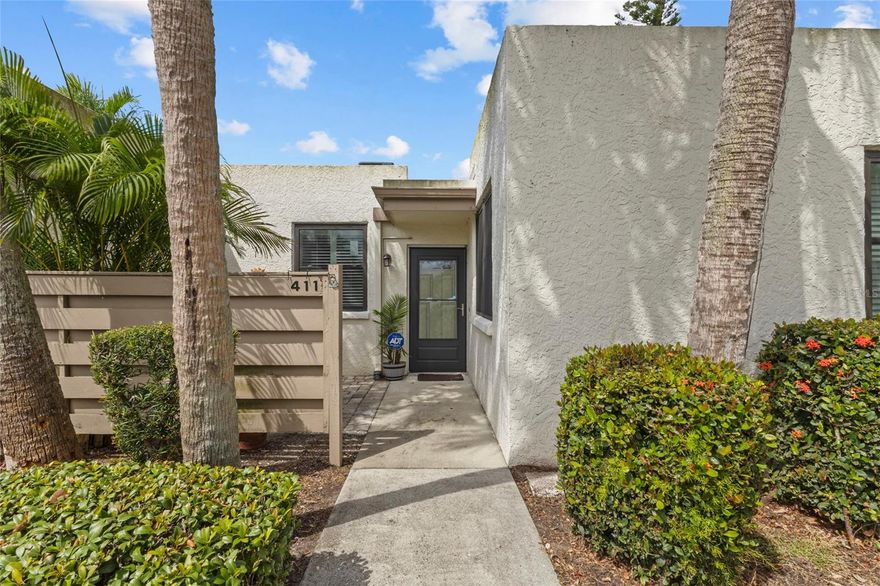 Nestled in the lush tropical landscape of Wildwood Springs, this charming ground floor condo offers a rare blend of privacy, comfort, and convenience with its beautifully maintained 2BD/2BA layout. Step inside to find an inviting open floor plan that flows effortlessly from the dining area into the crisp, updated kitchen featuring sleek cabinetry, stainless steel appliances, and a farmhouse style sink, perfect for both everyday living and entertaining. Updated bathrooms. Natural light fills the spacious living area, which opens directly into a tranquil Florida room where floor-to-ceiling windows invite the outside in and provide a peaceful view of manicured landscaping. A private front patio offers a welcoming entryway and a second space for enjoying Florida's year round sunshine. With tasteful upgrades and neutral tones, this residence is move-in ready yet provides plenty of opportunity to personalize. Community amenities include a heated pool and tennis/pickleball. Nestled within a sought after community known for its serene lakes and mature trees, this condo is a wonderful place to call home whether you're looking for a full-time residence or a seasonal retreat.