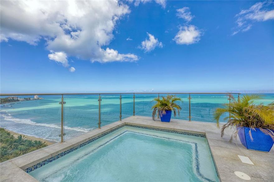 Updated in 2018, this unique, turnkey convertible 4 bedroom + den, 3.5 bathroom, approx. 4,365 sq. ft. two-story penthouse represents all that you can expect from beachfront living in Puerto Rico. 

Oceanfront and rolling directly onto the sand, the unobstructed, panoramic northern exposure views draw you towards the expansive floor plan that culminates at the rare to find exclusive rooftop space only available here at Plaza Atlantico. 

Pristine marble floors as well as double height windows expand throughout the open living, formal dining and family room. The brand new spacious designer kitchen, favoring the spectacular ocean landscape, is fully equipped with a water filtration system, custom cabinetry and top of the line appliances. The complete laundry suite has been retrofitted with water softening technology as well as custom cabinetry.

The en-suite master bedroom with large walk-in closet offers hardwood floors, as well as stand-alone basin tub and shower. The two additional bedrooms share a full bath. Den and office, showcase ocean views.

On the second level, a redesigned rooftop terrace features its own private pool with sunning areas and full bath, indoor/outdoor full chef’s kitchen inclusive of living, entertaining and dining space, all highlighting the horizon of the magnificent Atlantic Ocean.

With only 2 apartments per floor, Plaza Atlantico offers privacy, full back-up generator and water cistern, 24-hour guard, direct beach access and 3 garage parking spaces. The beach is your backyard, making this the perfect penthouse for entertaining and enjoying the laid back lifestyle the Island offers.

Monthly Condo Fee: $1,250
