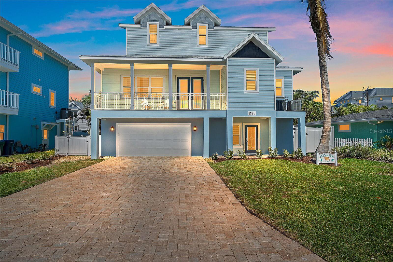Escape to your own piece of paradise on Anna Maria Island with this stunning coastal retreat nestled just 5 lots from beach access on 79th Street. Crafted in 2017, this immaculate home boasts modern elegance and thoughtful design, offering the ultimate blend of luxury and comfort. Spanning 2,394 square feet, this residence features 4 bedrooms and 3.5 bathrooms, providing ample space for family and guests. Step inside and be greeted by ceramic wood look tile flooring flowing seamlessly throughout, creating a warm and inviting ambiance. The fully furnished home allows for immediate enjoyment of island living. Modern conveniences like a washer and dryer and an elevator from the ground floor to the top add ease to daily life. The heart of the home, a gourmet kitchen, awaits the culinary enthusiast with state-of-the-art appliances, sleek cabinetry, and sprawling countertops. Retire to the primary suite on the main level for indulgence, featuring a lavish en-suite bathroom and a spacious walk-in closet. Discover three additional bedrooms upstairs that provide haven and seclusion for family and guests alike. Outside, three balconies offer breathtaking views, while the lush landscaping surrounding the sparkling heated pool invites relaxation. In 2022, the backyard was enhanced by adding turf and a putting green, providing extra opportunities for leisure and enjoyment. Additional features include a durable metal roof, a 2-car garage, and parking for 4 more cars in the driveway. Conveniently located just steps away from the beach, this home offers great rental potential and is zoned for weekly rentals, embodying the quintessential island lifestyle, where every day feels like a vacation. Don't miss your chance to own this slice of paradise in one of Florida's most desirable destinations. Schedule your private showing today and make your dreams of coastal living a reality!