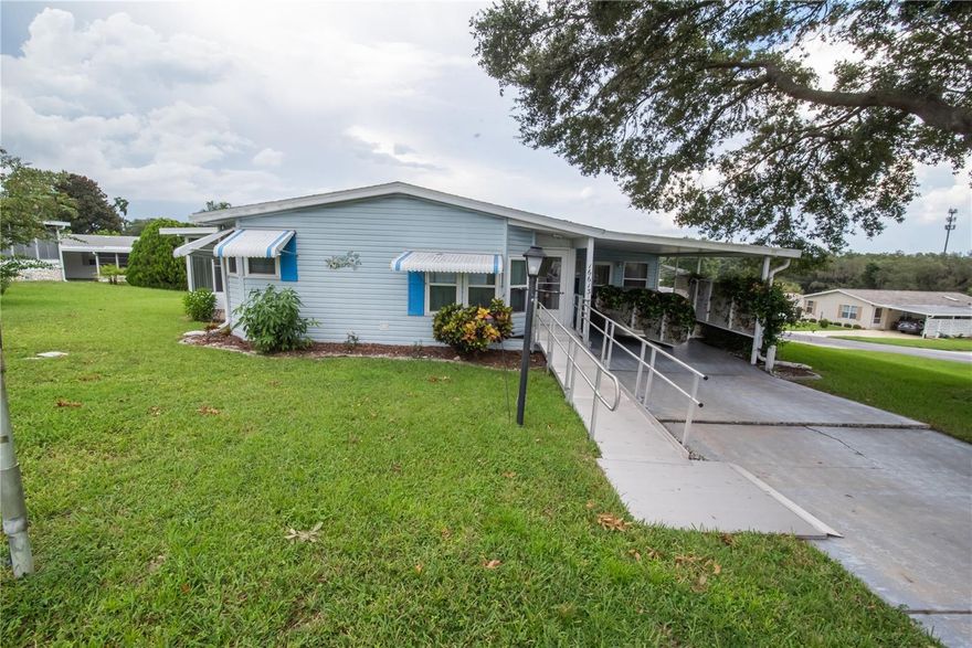 Welcome to Hilltop Estates – Where You Own the Land!
This beautifully maintained double-wide manufactured home is the best value in Hilltop Estates and comes TURNKEY ready! Nestled in a desirable 55+ community with low HOA fees, this home is conveniently located near shopping, entertainment, 5 minutes to the VA hospital, and is just under 10 minutes to the Summerfield DMV.

Featuring 2 bedrooms and 2 bathrooms, the home offers upgraded finishes including granite countertops, luxury waterproof vinyl flooring, and all new sinks, faucets, toilets, and cabinet hardware. A brand new roof with skylight was installed in February 2024, and the plumbing has been fully replaced—no gray pipes!

Enjoy the flexibility of a spacious bonus room complete with a built-in Murphy bed—perfect for guests, hobbies, or relaxation. Need room for tools or creative work? The property also includes an annexed tool shed, ideal for anyone ready to take on their next project.

Additional highlights:
Regular residential windows
New exterior outlets on the home and lanai
French drains and overflow pipes on both sides of the home
New light fixtures, yard light, mailbox, and shed door
Newer hot water heater, microwave, and garbage disposal
Interior fully painted in 2022 (walls, ceilings, cabinets)
 Irrigation system is well maintained
Contact to coordinate your tour
