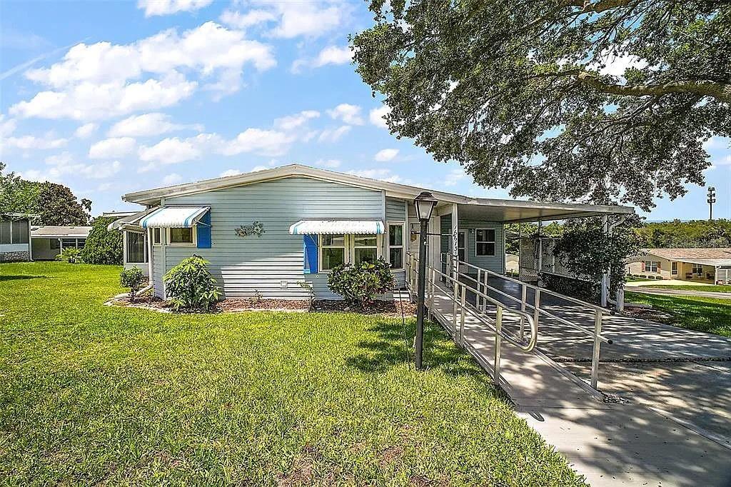 Welcome to Hilltop Estates – Where You Own the Land!
This beautifully maintained double-wide manufactured home is the best value in Hilltop Estates and comes TURNKEY ready! Nestled in a desirable 55+ community with low HOA fees, this home is conveniently located near shopping, entertainment, 5 minutes to the VA hospital, and is just under 10 minutes to the Summerfield DMV.
Featuring 2 bedrooms and 2 bathrooms, the home offers upgraded finishes including granite countertops, luxury waterproof vinyl flooring, and all new sinks, faucets, toilets, and cabinet hardware. A brand new roof with skylight was installed in February 2024, and the plumbing has been fully replaced—no gray pipes!
Enjoy the flexibility of a spacious bonus room complete with a built-in Murphy bed—perfect for guests, hobbies, or relaxation. Need room for tools or creative work? The property also includes an annexed tool shed, ideal for anyone ready to take on their next project.
Additional highlights:
Regular residential windows
New exterior outlets on the home and lanai
French drains and overflow pipes on both sides of the home
New light fixtures, yard light, mailbox, and shed door
Newer hot water heater, microwave, and garbage disposal
Interior fully painted in 2022 (walls, ceilings, cabinets)
Irrigation system is well maintained
Contact to coordinate your tour