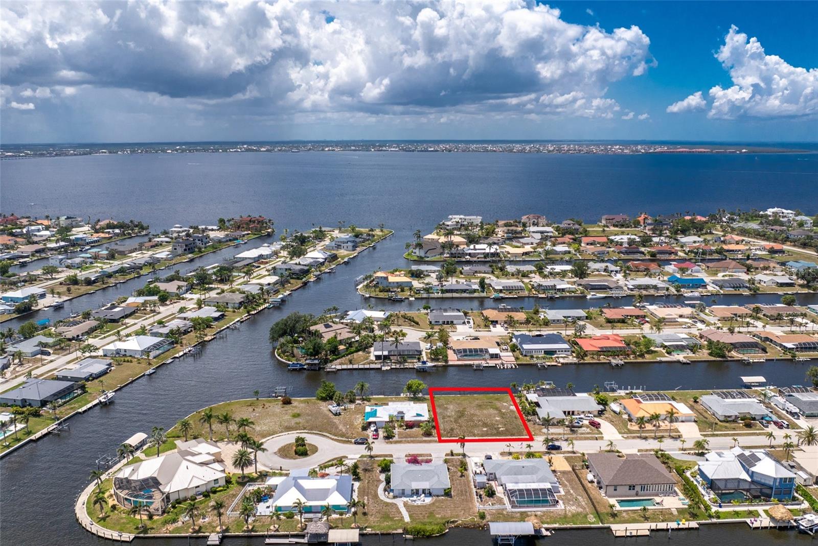 Spectacular Sailboat water lot just 600 yards from the open water of historic Charlotte Harbor. 100 yards on the 120 foot wide Stebbins Waterway then turn to starboard for 500 yards on the 140 foot wide Beeney Waterway and you’re in Charlotte Harbor. No bridges and plenty of depth. This 100’ X 125’ lot already has the seawall in place and utilities to the property line. Charlotte Harbor is a world class fishing and boating destination. Explore the Barrier Islands of Cayo Costa, Sanibel and Captiva, or the enclaves of Useppa Island and Cabbage Key or head out through Boca Grande Pass into the Gulf of Mexico. This is one of only 2 vacant lots on the street and is located near the end of the Cul -de- sac. Build your dream home just minutes from the new Sunseeker Resort, historic downtown Punta Gorda and there’s plenty of shopping and dining just minutes away. Fly direct into Punta Gorda Airport with Allegiant Airline or into Southwest Florida International Airport with the major airlines. You know what they say about waterfront property, “they’re not making any more of it”. Don’t miss your opportunity.