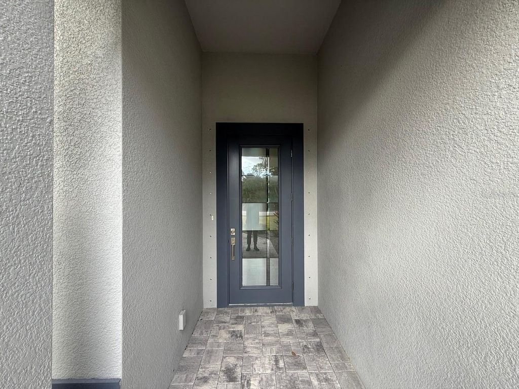 Photo of 14396 Chamberlain Boulevard, Port Charlotte, FL 33953 (MLS # C7521247)