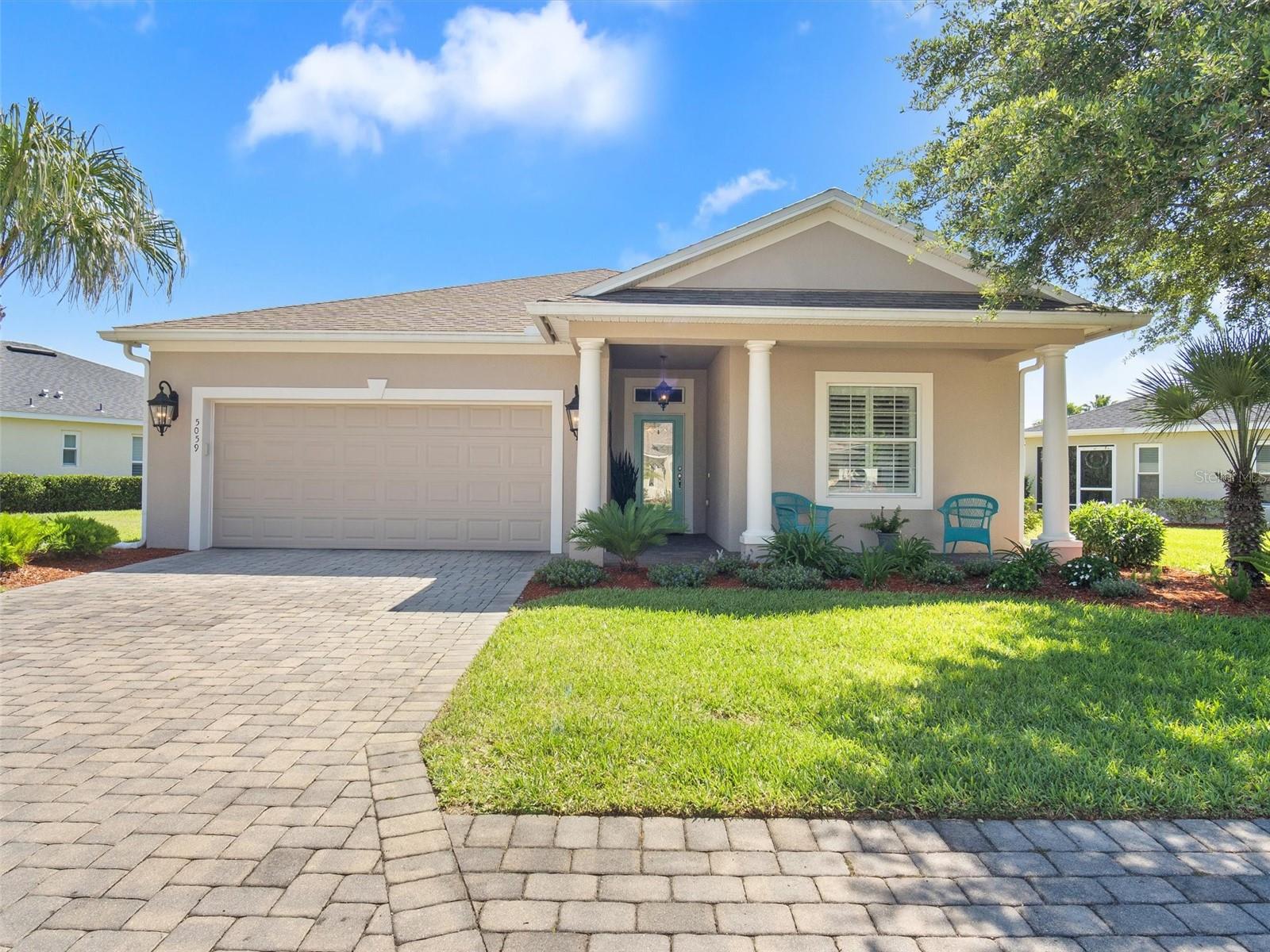 Charming 3/2/2 home located in Lakeside Landings convenient to The Villages and everything you come to Florida to enjoy! This home is block and stucco construction and has been well maintained throughout. The front porch has a leaded glass front door that adds upscale curb appeal and character to the home's entrance. The open floor plan with vaulted ceilings in the great room and high ceilings throughout the home certainly create a spacious and airy feel to the living areas. The tall sliding glass doors that lead out to the 10'x20' lanai, paver patio, and grilling area create a great indoor-outdoor flow and provide plenty of options for entertaining. The large kitchen with under-cabinet and above-cabinet lighting, lower cabinet pullout shelving, and quartz countertops is not only functional but also very stylish. The in-kitchen seating provides a comfortable and casual dining option. The master bedroom has a door leading out to the lanai, large walk-in closet, and master bath with double sinks and a walk-in shower that offers a comfortable and private retreat within the home. Guest bedrooms share a bathroom with a tub and shower. Both have nice size closets and have been recently re-carpeted. Additionally, the flexible third bedroom can double as a den or office and is a great feature for anyone who needs extra space for work or hobbies. This room's versatility allows homeowners to customize their living space to meet their needs, making this home even more appealing. Also, have to mention that the home has plantation shutters throughout! The Lakeside Landings community is a prime location on the west central edge of The Villages, offering residents convenient access to all the shopping and entertainment that the area has to offer. For those who need to travel outside the immediate area, Lakeside Landings is just a short distance from I75 and the Florida Turnpike, making it easy to get to other destinations. One of the key benefits of living in the Lakeside Landings community is the comprehensive HOA coverage that is included in the monthly fees. The HOA covers irrigation, lawn and garden care, as well as access to the community's impressive 13,000-square-foot clubhouse. The clubhouse features a fitness center, billiards and card room, library, banquet hall and dance floor, stage, and catering kitchen. Residents can also take advantage of the community's resort-style pools, spa, cabana, putting green, and tennis and pickle-ball courts. For families with children, there is a playground area, and for those with furry friends, there is a dog park within the community. In summary, living in the Lakeside Landings community offers a wide range of amenities and conveniences. With access to shopping, entertainment, schools, and major highways, Lakeside Landings is an ideal location. Overall, this charming and move-in-ready home with updated features and flexible spaces is a great option for anyone looking for a comfortable and convenient Florida home.