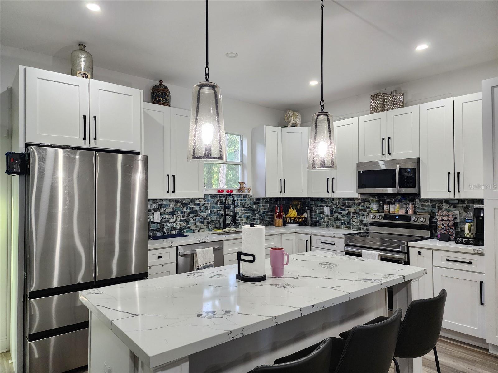 For sale: This immaculate, contemporary home located in the desirable Golden Gate Estates offers modern living on a spacious 2.73-acre lot. Built in 2024 and gently lived in for just one year, the property features 3 bedrooms, a versatile den, and 2 full bathrooms laid out in an open-concept design that provides both comfort and functionality. The quartz kitchen countertops, impact-resistant windows and doors, and elegant finishes throughout add a touch of sophistication. With ample outdoor space, this property offers the perfect opportunity to build a guest house, workshop, or recreational area, all without HOA restrictions. Surrounded by nature yet conveniently located near top schools and amenities, this home is ideal for those seeking privacy, flexibility, and the chance to expand their dream lifestyle in Southwest Florida.