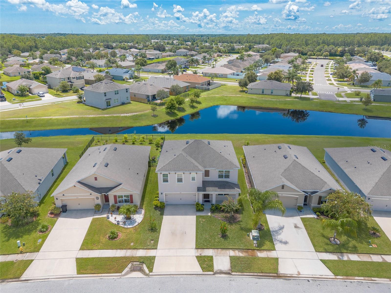 Welcome to Hawks Preserve, where comfort, style, and location come together in this stunning lakefront home. Built in 2019 by DR Horton, the popular Hayden model offers an impressive blend of space, design, and natural beauty. From the moment you step inside, you'll be greeted with gorgeous views of the lake and surrounding wildlife from both main living areas, creating a peaceful backdrop for everyday living.
Constructed with solid concrete block and frame, this two-story home features 5 bedrooms, 3 full bathrooms, and 3 spacious living areas—ideal for large families or those who love to entertain. The open, airy kitchen is highlighted by gleaming granite countertops and flows seamlessly into the dining and living spaces, perfect for gathering with friends and family. A full bedroom and bathroom on the first floor provide convenience and flexibility for guests or multigenerational living, while upstairs you'll find four additional bedrooms, including the owner's suite, along with two more full baths and a bonus living area for added privacy.
Outside, enjoy peaceful walks along the winding community paths, relax by the sparkling pool, or let the little ones explore the playground. Just around the corner, you'll find the Coraci Sports Complex with baseball, football, and soccer fields, as well as The Pavilion outdoor shopping mall with dining, retail, and entertainment options. Best of all, this prime location is just minutes from the beaches, I-95, and I-4, offering quick access to everything the area has.
This is more than just a house, it's the lifestyle you've been waiting for.