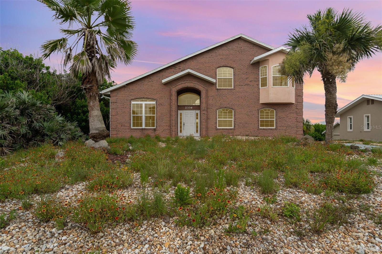 Welcome to 2336 S Central Avenue, a spacious 3-bedroom, 3-bathroom home nestled in the heart of Flagler Beach, Florida. Boasting 2,541 square feet of living space, this residence offers a rare combination of coastal charm, functionality, and room to grow perfect for families, snowbirds, or savvy investors alike. From the moment you enter, you'll be struck by the generous scale of the interior living areas. The main level is designed with openness and light in mind, featuring soaring ceilings. The oversized living room flows seamlessly into an expansive dining area, offering plenty of room for entertaining, family gatherings, or relaxed evenings at home. Just off the living space, you’ll find a kitchen offering abundant cabinetry, and the same abundance of light found through the rest of the home. The spaciousness continues into the bedrooms, each offering comfort and flexibility. The primary suite, located on the main floor, is a true retreat with a large layout, generous closet space, and a well appointed en-suite bath featuring a soaking tub, and a separate shower. Upstairs, a loft area connects two additional bedrooms that also enjoy ample space, natural light, and access to a full bath ideal for kids, guests, or a home office setup. Additional highlights include a spacious garage, updated lighting fixtures, and close proximity to beach access just a short walk away at 23rd Street. The home sits on a 0.26-acre lot and is not part of an HOA, allowing greater flexibility for owners. Located in the laid-back and picturesque coastal town of Flagler Beach, this property offers more than just a beautiful home; it’s a gateway to Florida’s best lifestyle. Enjoy morning walks on the beach, bike rides along scenic A1A, weekly farmers markets, live music at beachfront restaurants, paddle boarding on the Intracoastal, or exploring nearby nature trails and state parks. With easy access to Daytona Beach, St. Augustine, and I-95, you're never far from big-city conveniences while still enjoying a quiet, small-town coastal vibe. Whether you're looking for a full-time residence, vacation getaway, or rental investment, 2336 S Central Avenue is a versatile and turnkey opportunity that’s ready for its next chapter. Don’t miss out.