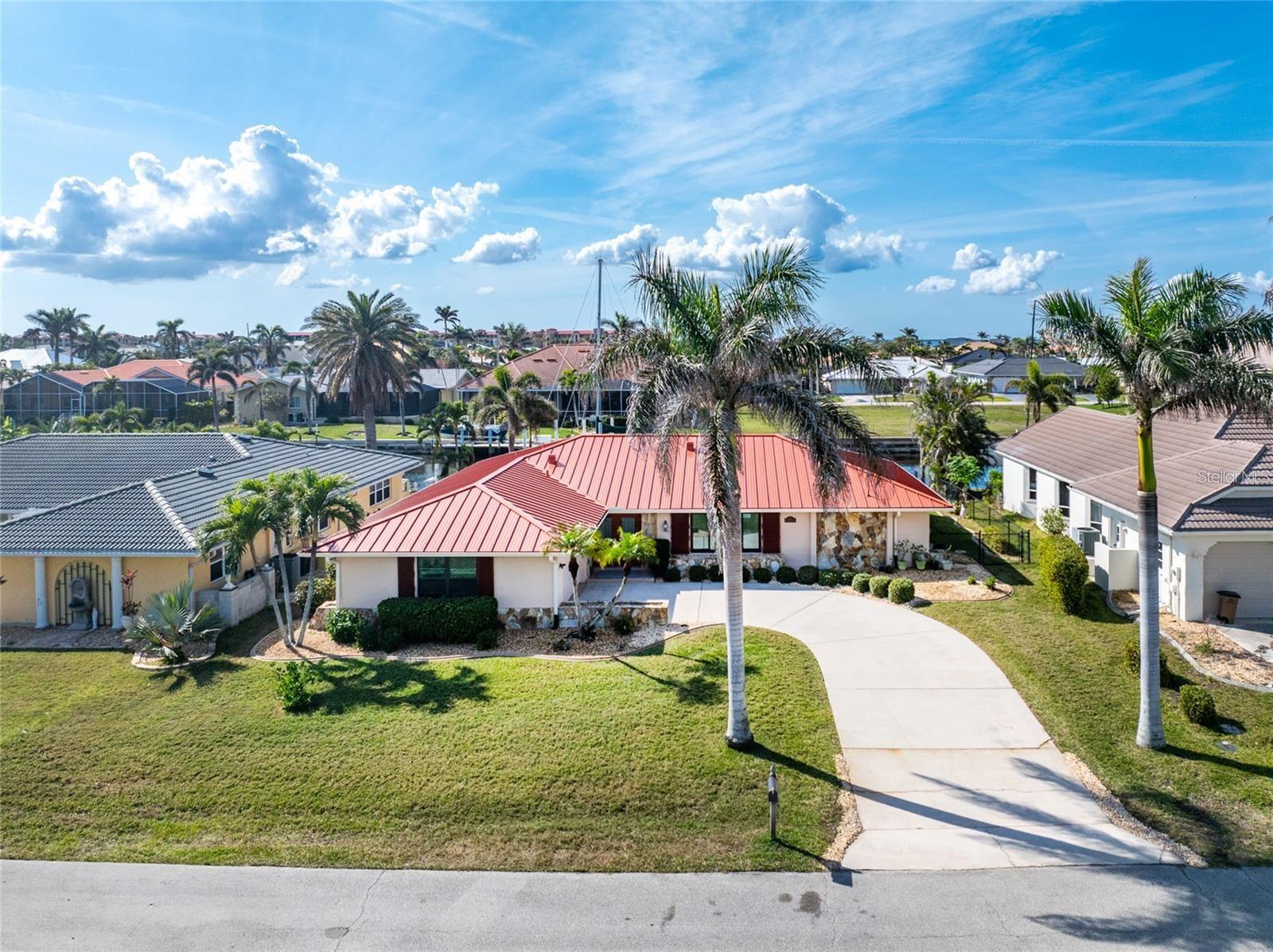FOR RENT: Waterfront unfurnished 3 Bedroom, 2 bathroom home with attached 2 car garage. Located in a quiet neighborhood in the desirable deed restricted community of PUNTA GORDA ISLES. This home offers a Great Room, Florida Room, well appointed Kitchen, Inside Laundry Room, screened Lanai. Numerous upgrades throughout. Great water views, concrete seawall, 40 foot concrete dock, 10,000 lb boat lift. 28x14 inground pool. City water and sewer. Punta Gorda Isles is deed restricted but there is NO HOA. Utilities are city water and sewer. This home is 5 minutes from Golf and 10 minutes from Fishermen's Village and historic downtown Punta Gorda shopping, dining, medical care, waterfront parks, boat ramps, fishing piers, walking and biking paths, art galleries, Charlotte Harbor Event Center, weekend farmers markets, downtown events and more! T