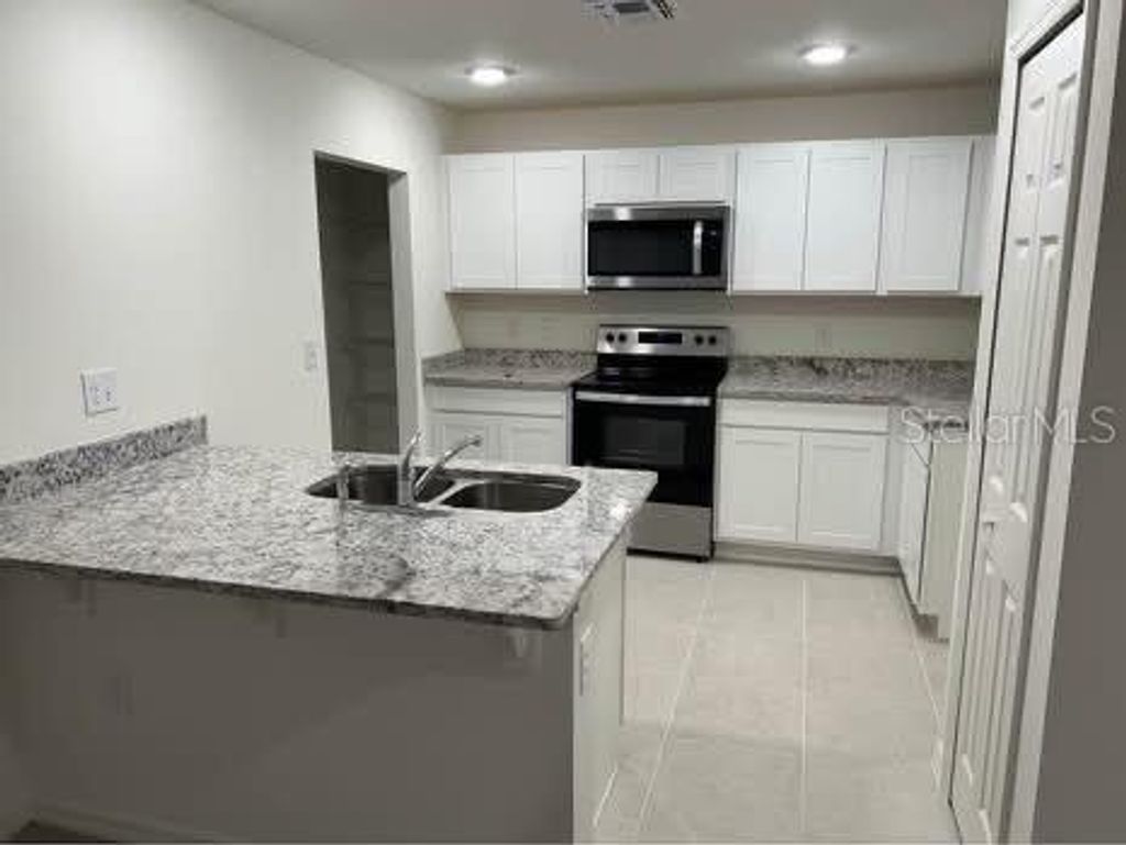 Photo of 351 Towns Circle, Haines City, FL 33844 (MLS # S5142131)