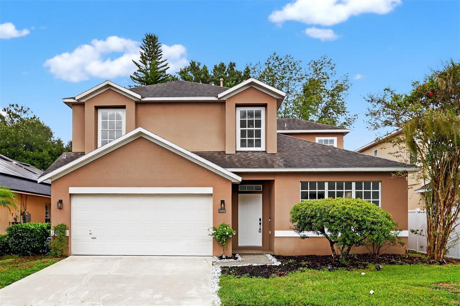 Located in the sought-after neighborhood of University Pines in Orlando, this fully renovated 4 bedroom, 3.5 bathroom home offers 2,990 square feet of living space on a spacious lot with serene views of Lake Ruth in the backyard. A standout feature of this home is the INDOOR POOL, providing a private oasis for relaxation and entertainment. The property also includes a separate screened-in patio overlooking the backyard, perfect for gatherings and enjoying the sunsets. From the moment you arrive, you’ll notice the gorgeous curb appeal, manicured landscaping with garden beds, shrubs, and palm trees, and a two-car garage. Inside, brand-new luxury vinyl plank flooring and modern light fixtures enhance the open and inviting atmosphere. The updated kitchen features stainless steel appliances, quartz countertops, and a clear view of the pool area. Each bedroom is bright and airy with large windows and ceiling fans. The primary bathroom includes a sit-in tub, decorative tile-lined shower, and his-and-her sinks, while the other bathrooms are updated with modern vanities and tile-lined showers as well. Living in Orlando offers access to world-class dining, shopping, entertainment, lakes, parks, and convenient proximity to downtown and major highways, making this home a perfect combination of luxury, comfort, and location.