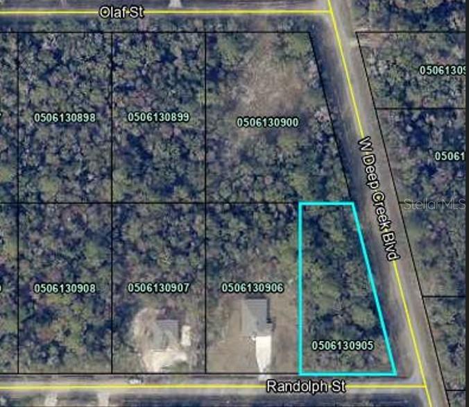 .89-acre wooded corner lot in Flagler Estates, offering privacy and plenty of space to build your home. Subdivision allows single-family, mobile, or modular homes with county approval. Sewer is by septic and water by well (not installed). Zoned for horses and chickens, providing flexibility for your plans. Directly behind this property, 4815 Olaf St (1.51 acres) is also available, creating a rare opportunity to own two adjoining parcels. Conveniently located just 20 minutes to Palm Coast, Palatka, St. Augustine, and the beaches. More photos to come!