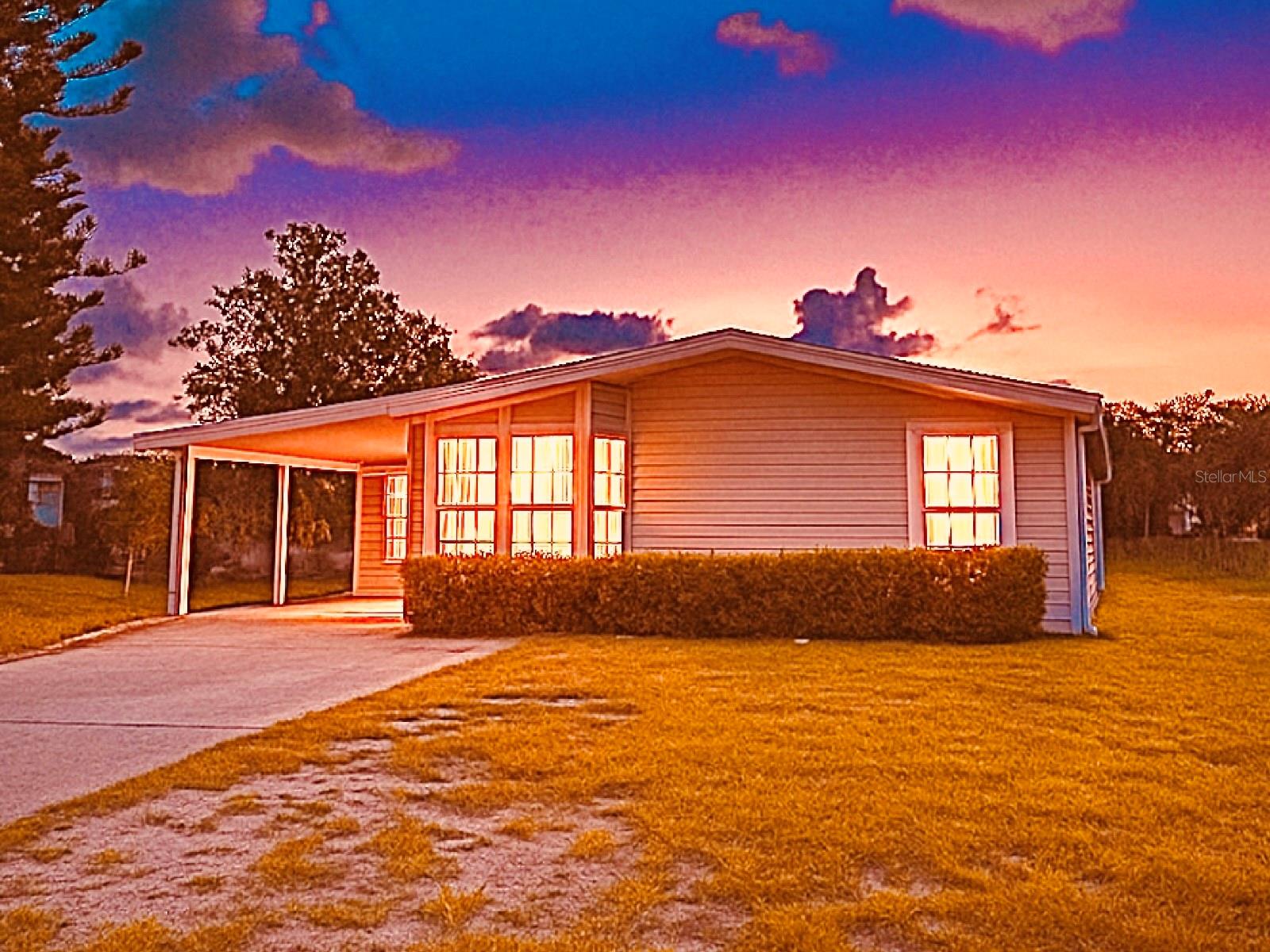 Lake Bonnet Living with Stunning Views – No HOA! Enjoy peaceful country living with breathtaking lake views, just 30 minutes from Disney World and Central Florida attractions! This spacious manufactured home sits on Lake Bonnet, offering the perfect blend of tranquility and convenience. Step inside to an open floor plan filled with natural light and sweeping views of the water from the sun porch. The kitchen is equipped with newer stainless steel appliances, making meal prep a breeze. The primary bedroom features an en-suite bathroom, creating a private retreat at the end of the day. While the home is move-in ready, it offers an opportunity to add your own updates and personal touches. Imagine designing your perfect lakefront getaway! With no HOA, you’ll have the freedom to enjoy the property as you wish. Whether you’re looking for a full-time residence, a vacation escape, or an investment, this home checks all the boxes. Don’t miss your chance to enjoy the beauty of Lake Bonnet living—schedule your showing today!