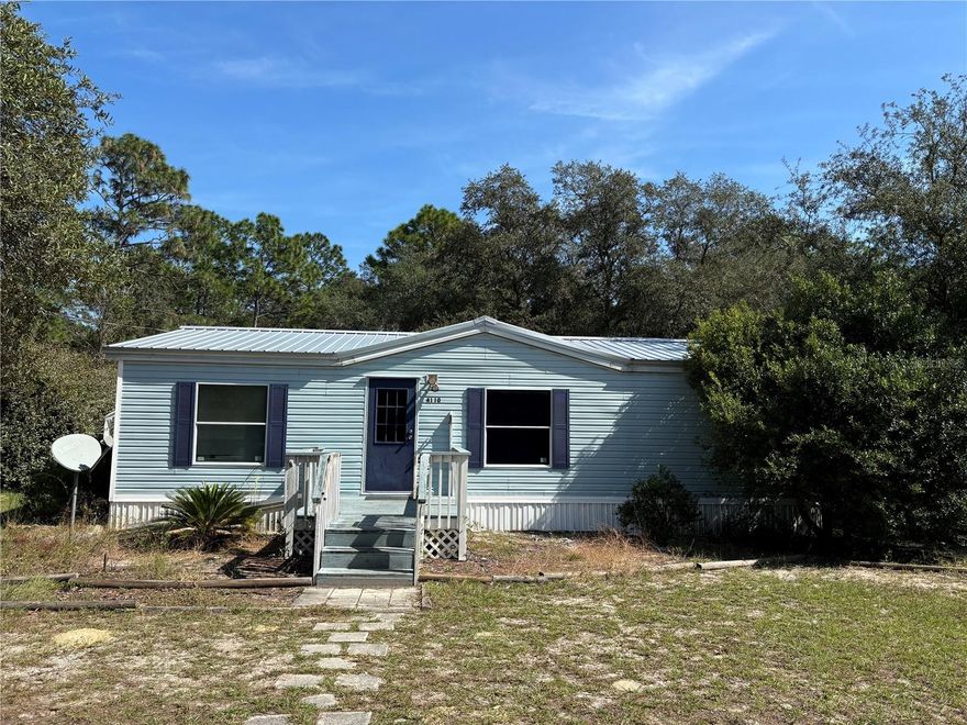 Calling All Investors!! Rural Living with Close Proximity to Ocala where there is NO HOA!! 2 bedroom, 2 bathroom with right under 1,000 square feet. This cute double-wide sits on 1/2 of an acre lot in Rainbow Lake Estates. Beautiful Floor Plan with Split Bedrooms. Both Bedrooms are very spacious. Huge Primary Bathroom with Walk in Shower. Metal Roof 2022. HVAC system updated in 2022. Upgraded Kitchen Fridge. Covered Deck. Huge Backyard that has a storage shed and ample space for entertaining. Plenty of Trees to enjoy the shade. Completely fenced property with entry gate. Storage Shed in the backyard. NO FLOOD ZONE. Less than 15 minutes to Rainbow River Springs State Park. Less than 30 minutes to downtown Ocala. Cash Only!!