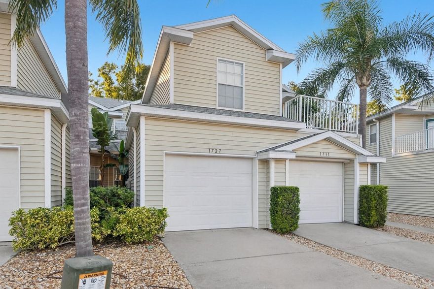 One or more photo(s) has been virtually staged. Welcome home to a true maintenance-free gem in the gated community of Lakes of Heron Cove! This ground-floor 2-bedroom, 2-bath home sits on a serene conservation lot with a view of the lake and canal, offering a little extra privacy with no close rear neighbors. Inside, you’ll find a thoughtful split floor plan that offers both comfort and flow, featuring a large kitchen with plenty of counter space, a warm and inviting breakfast bar that seats four, and space for a dining set. The baths and kitchen retain their original charm, while the primary ensuite features dual vanities, a spacious bedroom, and a large walk-in shower. This energy-efficient unit helps keep power bills low, and the attached garage provides a dry parking spot plus extra storage. Major updates include a 2021 water softener, 2020 A/C, 2022 hybrid water heater, 2023 washing machine, 2025 garbage disposal, and 2025 garage spring. The washer and dryer convey, so you can move right in and start enjoying your new home. The HOA takes care of the roof, exterior paint, and lawn maintenance, giving you more time to relax and enjoy the community pool and dock on a private lake, as well as the spa and private boat ramp. Conveniently located just minutes from restaurants, shopping, malls, expressways, and more, this care-free condo offers the perfect balance of comfort, convenience, and tranquility. Call today to schedule your showing!