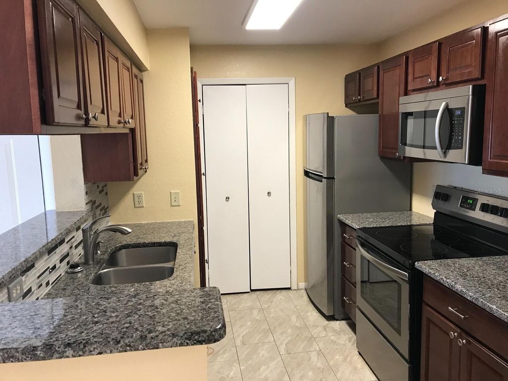 Photo of 4301 Lizshire Ln #203, Orlando, FL 32822 (MLS # O6372824)