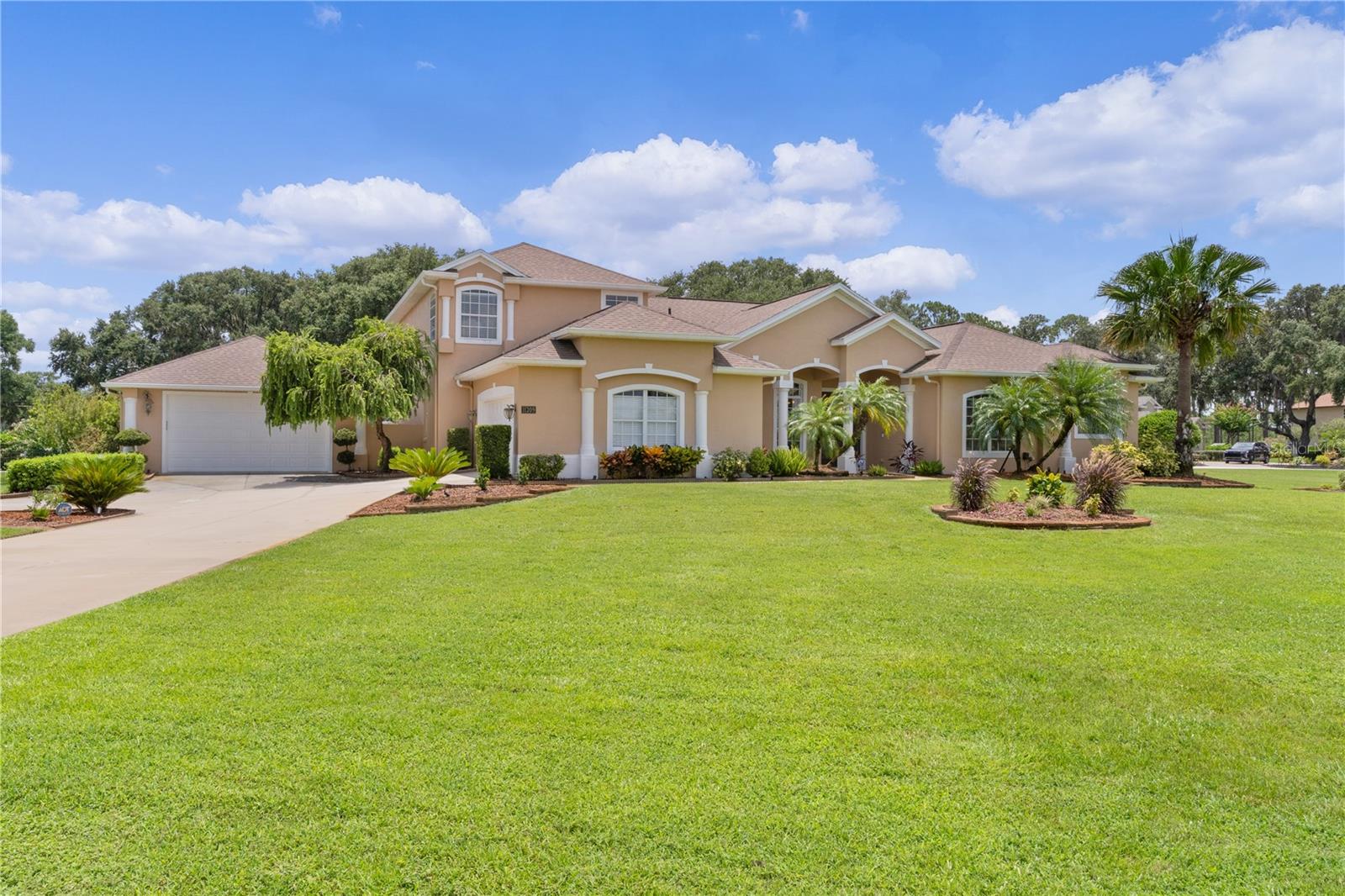 Stately Corner-Lot Retreat in Sought-After Arrowtree!
4 Bed | 4 Bath | 1.37 Acres | 3,900+ Sq Ft | Bonus Garage + Pool
Welcome to your dream home in the highly desirable Arrowtree Reserve community! Perfectly situated on a picturesque 1.37-acre corner lot, this stunning estate blends timeless curb appeal with modern upgrades. Conveniently located near the Florida Turnpike, Mission Resort + Club golf course, and a nearby public boat ramp leading to The Harris Chain of Lakes, and the scenic Dora Canal, this home is a haven for those who appreciate both adventure and relaxation.
Inside, you’ll find nearly 4,000 sq ft of elegant living space featuring 4 spacious bedrooms, 4 full bathrooms. The layout is accented by travertine and wood flooring in the main living areas, with plush carpet in the guest rooms and media room. The kitchen is a showstopper with stainless steel appliances, custom cabinetry, and beautiful finishes, perfect for both everyday living and entertaining.
The owner’s suite is a private retreat with a serene sitting area for reading or unwinding, while the guest ensuite on the opposite side of the home offers privacy and comfort for visitors.
This home is packed with upgrades:
• 2023 Roof & HVAC – both still under warranty
• Smart home features including app-controlled thermostats, security system, and surge-protected outdoor electrical panels
• Media room with projector for movie nights or big game viewing
• Brand-new garage door motors for both garages
• Two electric fireplaces adding charm and ambiance, without the heat
• Custom Built In Closet
One of the standout features is the detached 24x30 garage with 220V electrical, ideal for a car enthusiast, woodworking shop, or even a creative studio or craft space.
Step outside to your private resort-style pool area, beautifully landscaped and surrounded by mature oak trees, offering the perfect retreat for relaxation, entertaining, or simply enjoying Florida’s outdoor lifestyle.
And here’s a little something extra: tucked discreetly within the home is a hidden safe, perfect for storing important documents, keepsakes, or those treasures you want to keep “for your eyes only.” (Don’t worry, we’ll show you where it is once it’s yours!)
This one checks all the boxes! Space, functionality, updates, and location. It has been beautifully maintained and is move-in ready!
Don’t miss your chance to own this incredible home in one of Lake County’s most beloved communities!